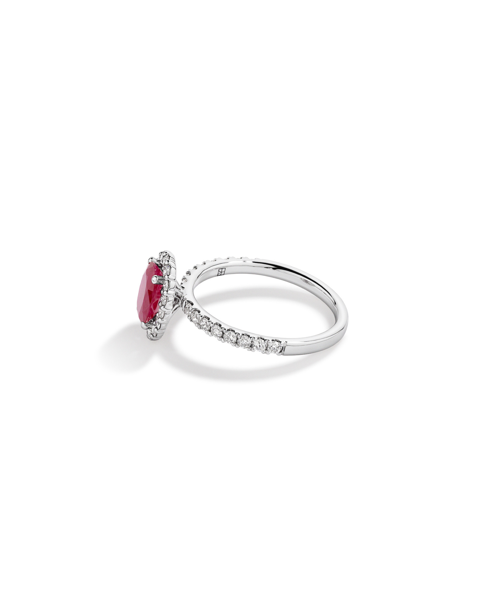 Oval Cut Red Ruby Gemstone and 0.60 Carat TW Diamond Halo Ring in 14kt White Gold