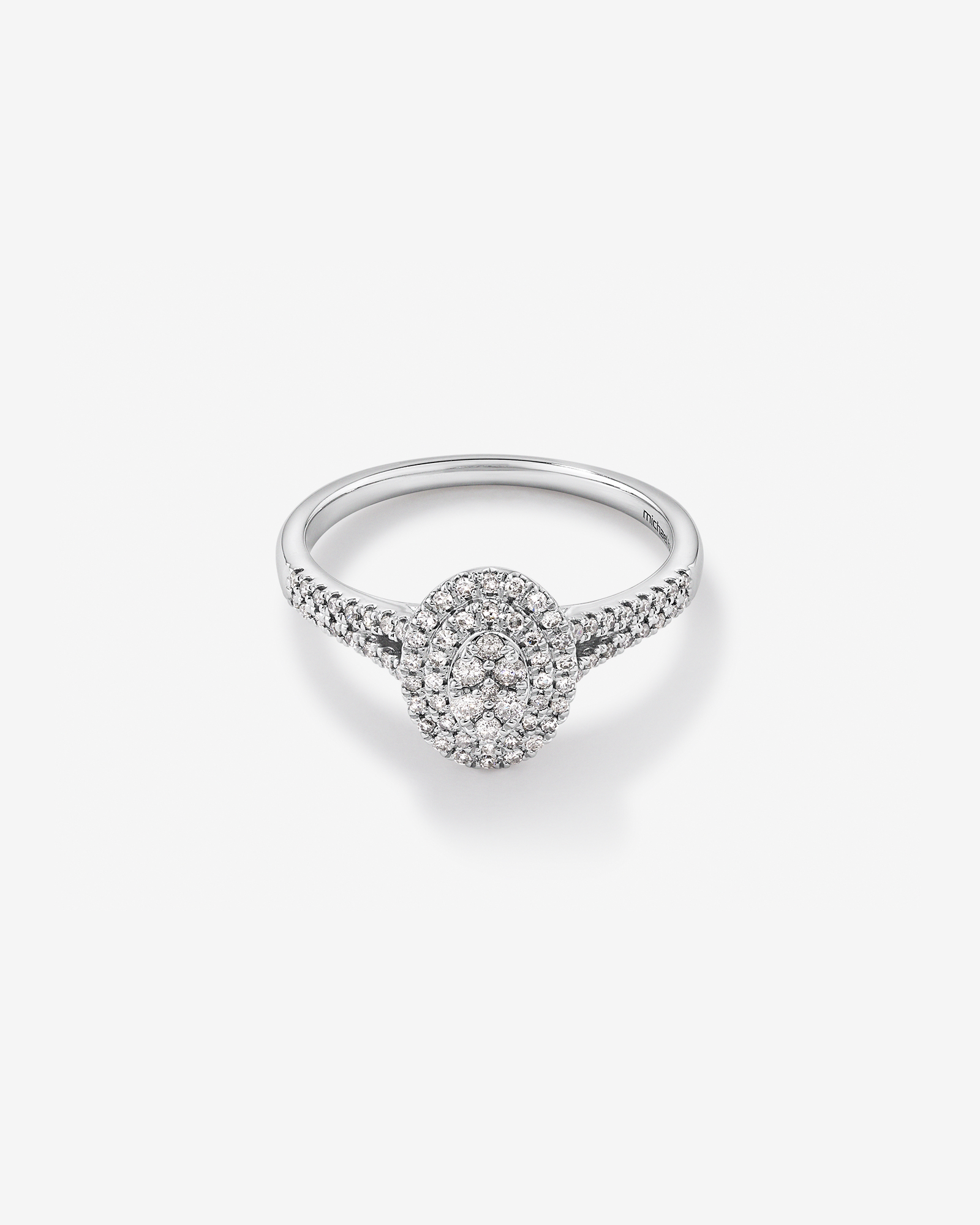 0.30 Carat TW Oval Shaped Cluster Halo Diamond Ring in 10kt White Gold