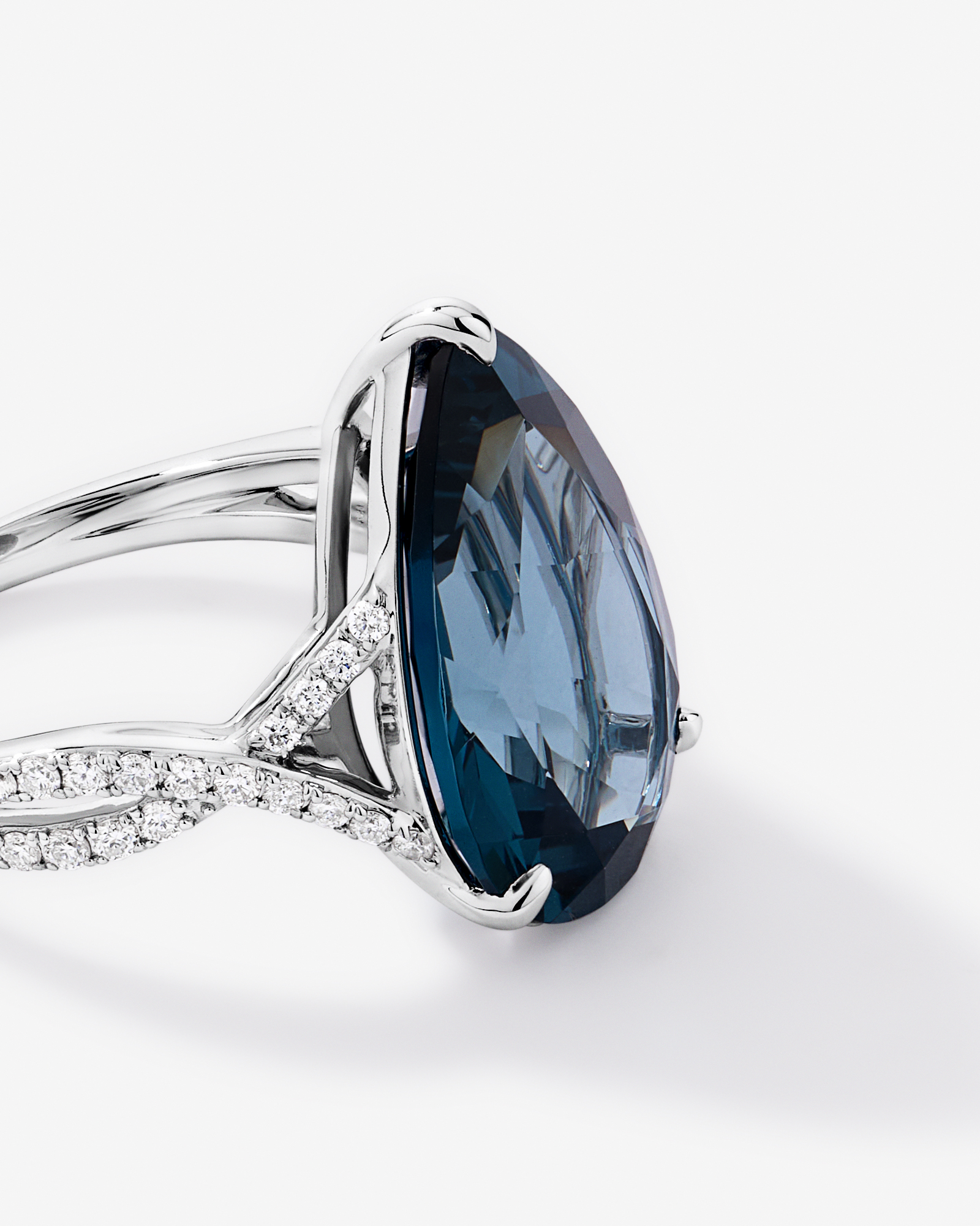 Pear Cut London Blue Topaz & 0.28 Carat TW Diamond Twist Ring 10kt Gold