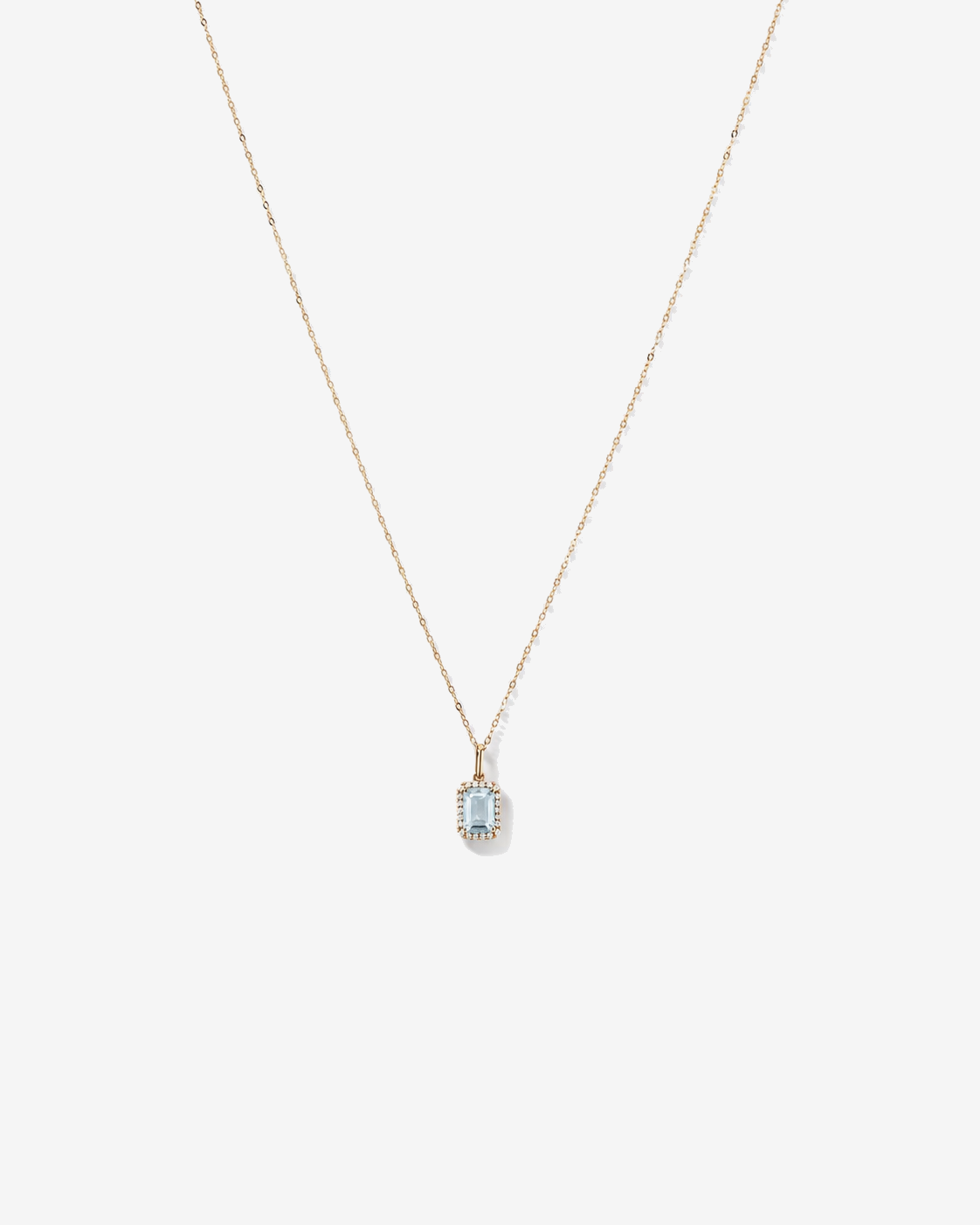 Emerald Cut Aquamarine and Diamond Halo Pendant with Chain in 10kt Yellow Gold