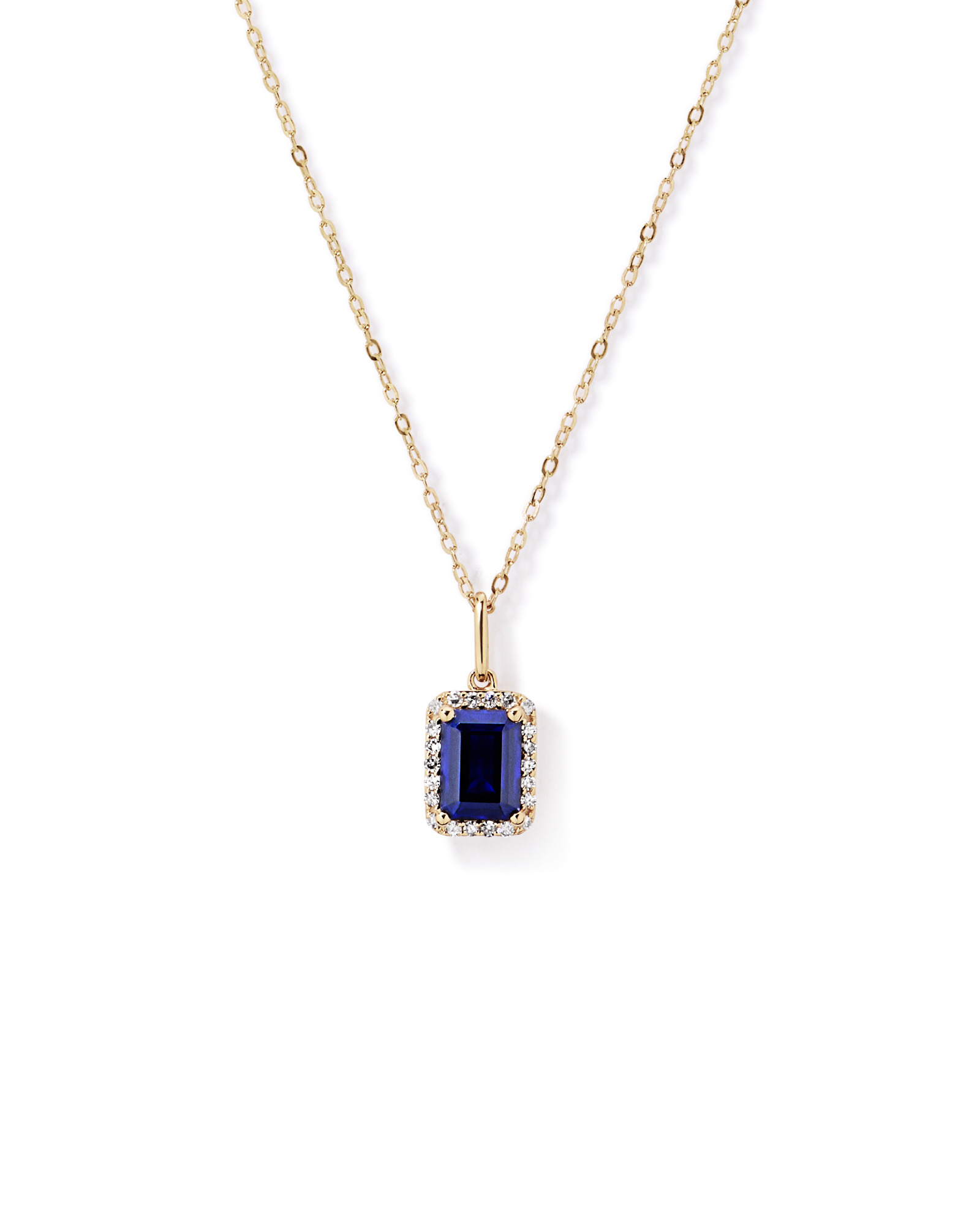 Emerald Cut Created Sapphire and Diamond Halo Pendant with Chain in 10kt Yellow Gold