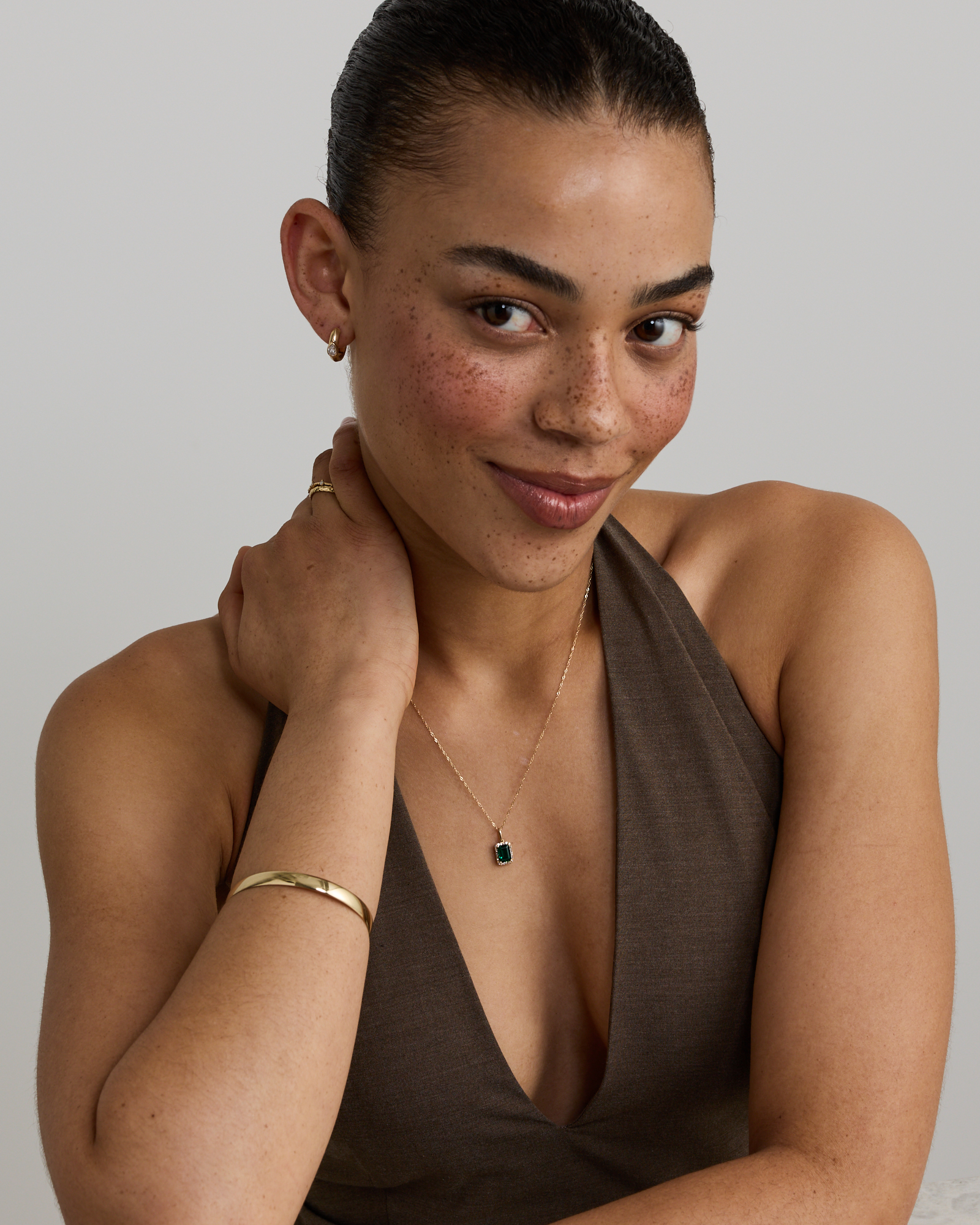 Emerald Cut Green Created Emerald Gemstone and  Diamond Halo Pendant with Chain in 10kt Yellow Gold