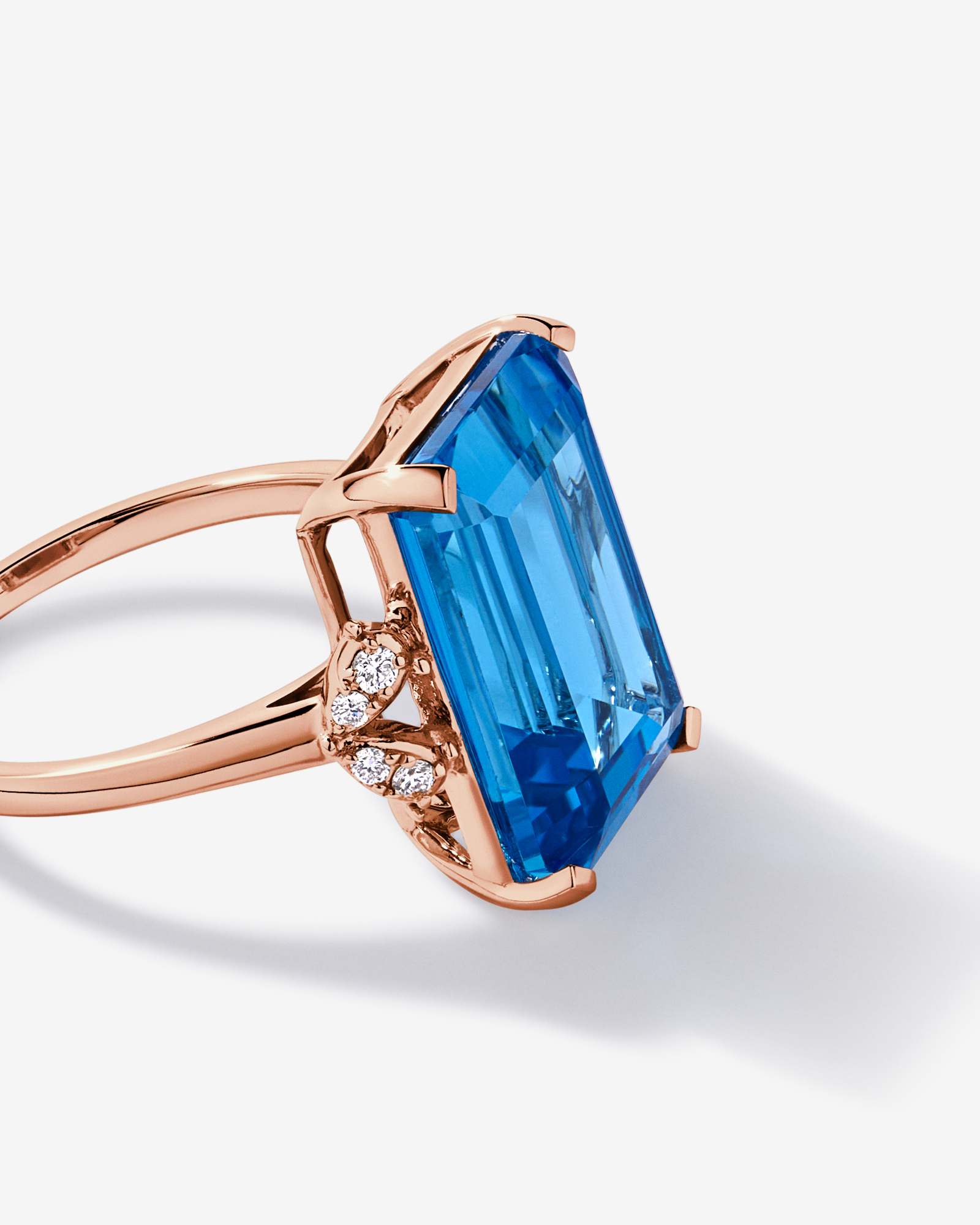 Emerald Cut Swiss Blue Topaz & 0.08 Carat TW Diamond Ring 10kt Rose Gold