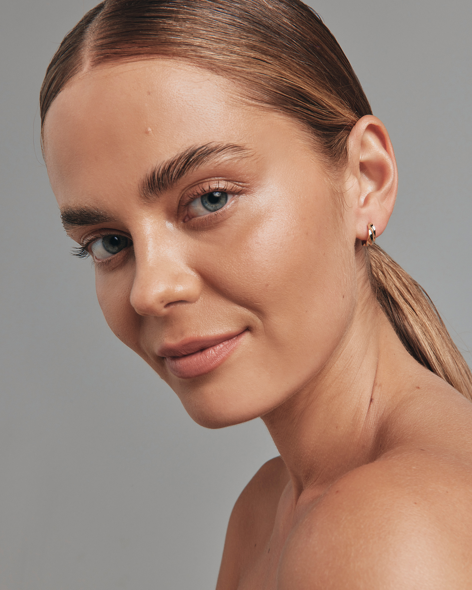 Créoles huggie torsadées Croissant de 10 mm en or jaune 10 carats