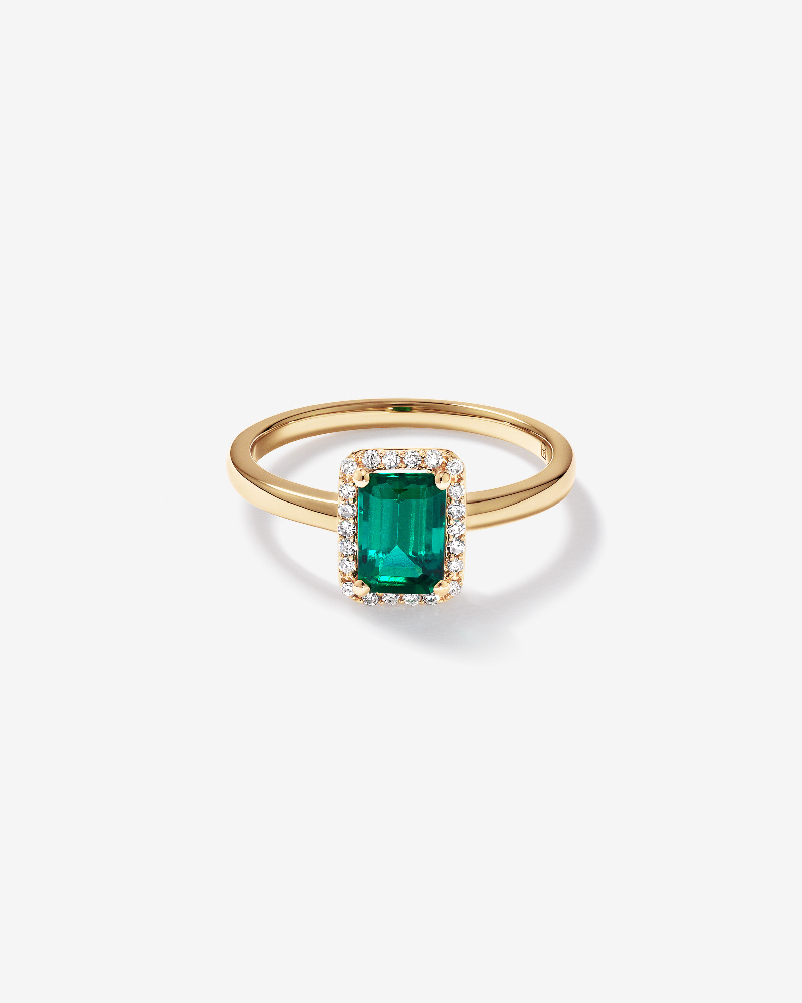 Bague en or jaune 10 carats avec émeraude verte synthétique taille émeraude et halo de diamants