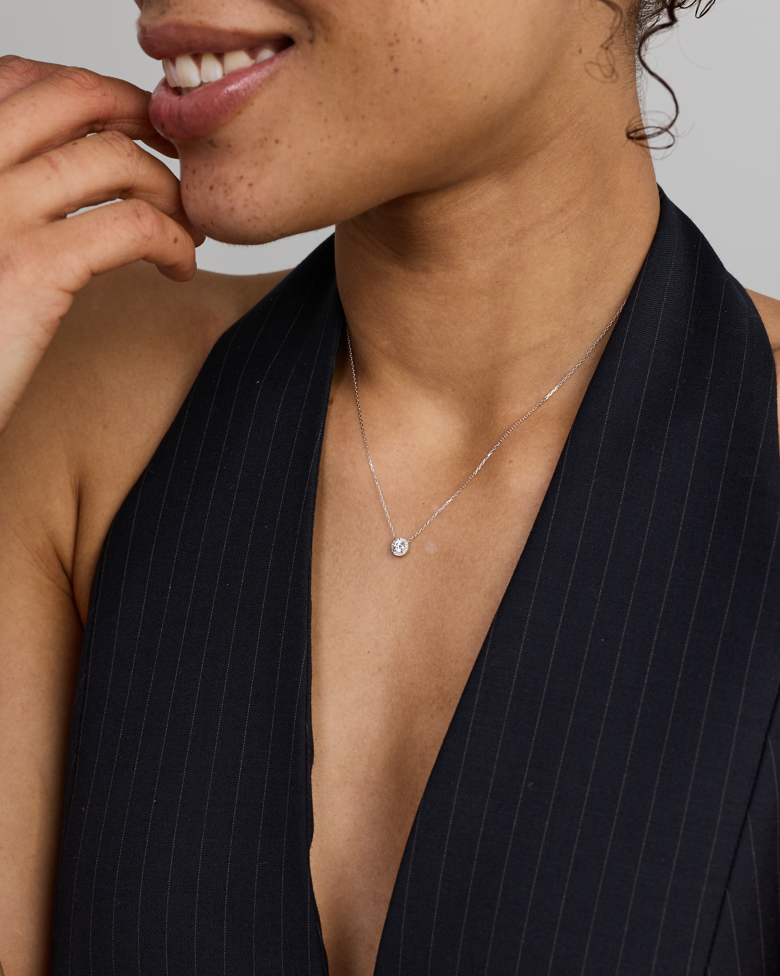 0.22 Carat TW Round Diamond Halo Pendant in 10kt White Gold