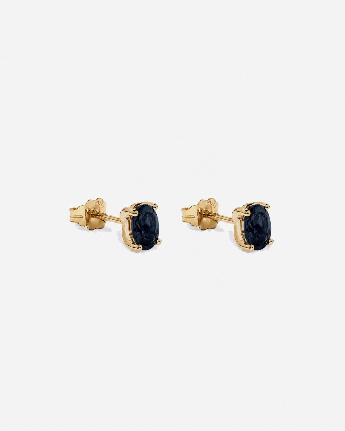 Boucles d'oreilles puces ovales Topaze bleu London en or jaune 10 ct