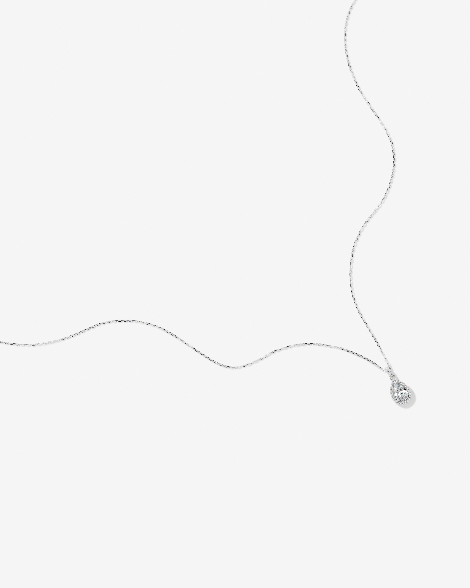 Pear Cubic Zirconia Halo Pendant Necklace in Sterling Silver