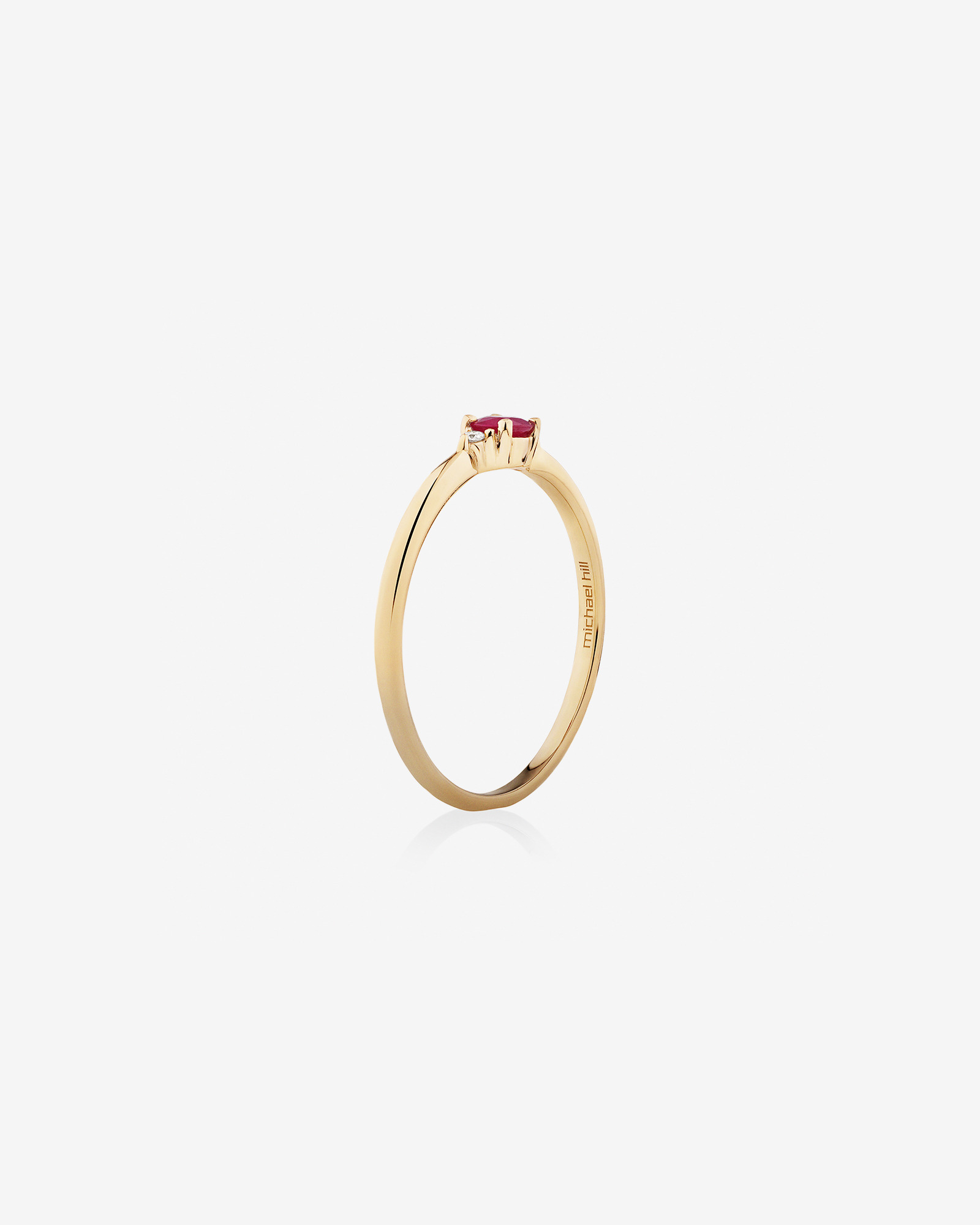 3 Stone Ring with Ruby & Diamonds in 10kt Yellow Gold