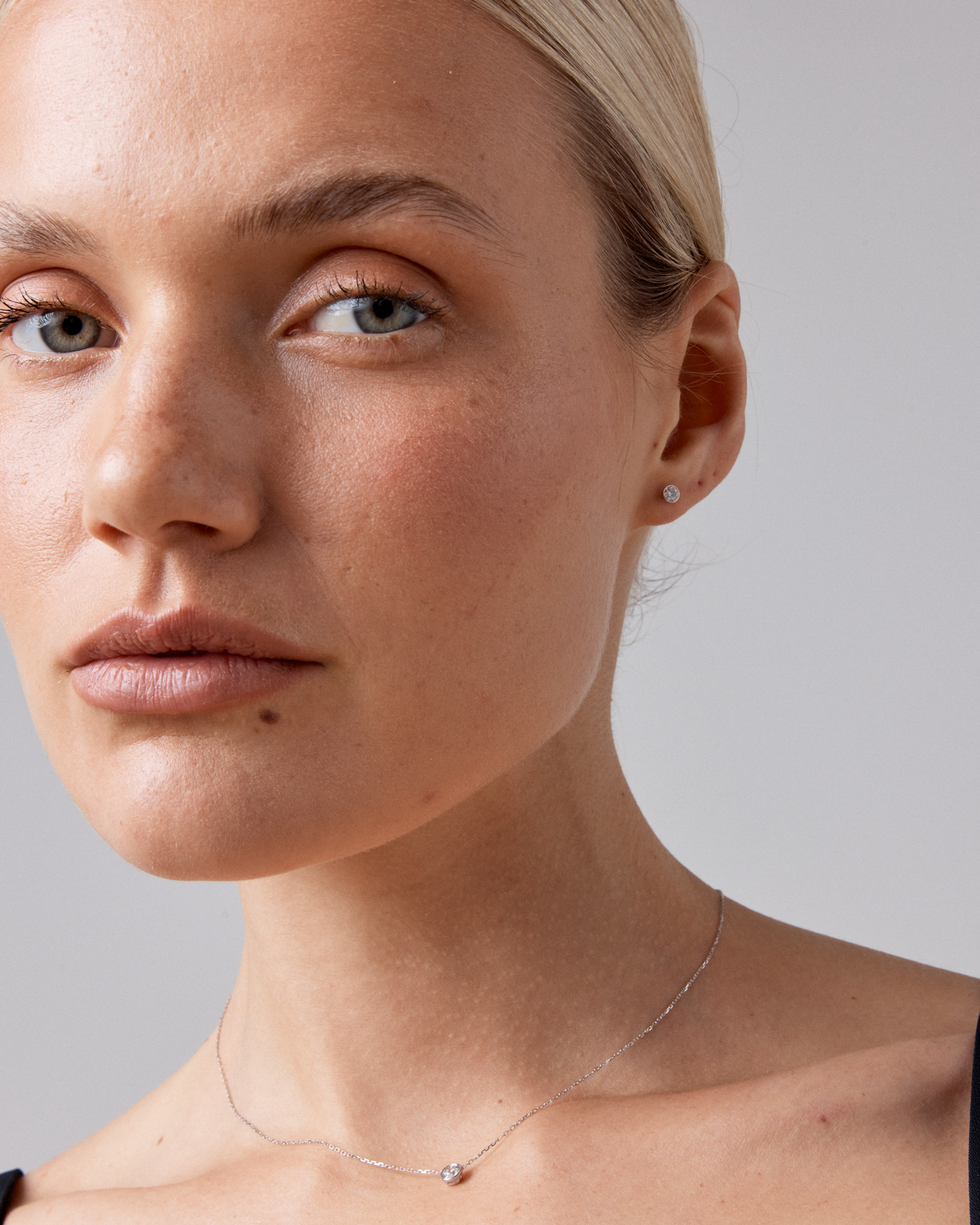 0.25 Carat TW Round Brilliant Diamond Solitaire Bezel Set Stud Earrings 18kt White Gold