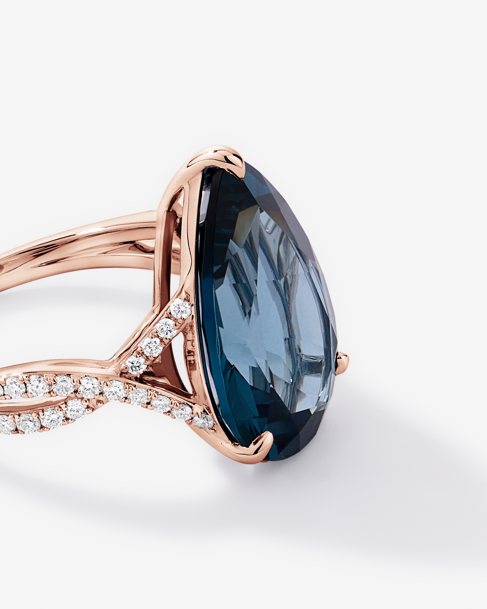 Pear Cut London Blue Topaz & 0.28 Carat TW Diamond Twist Ring 10kt Rose Gold