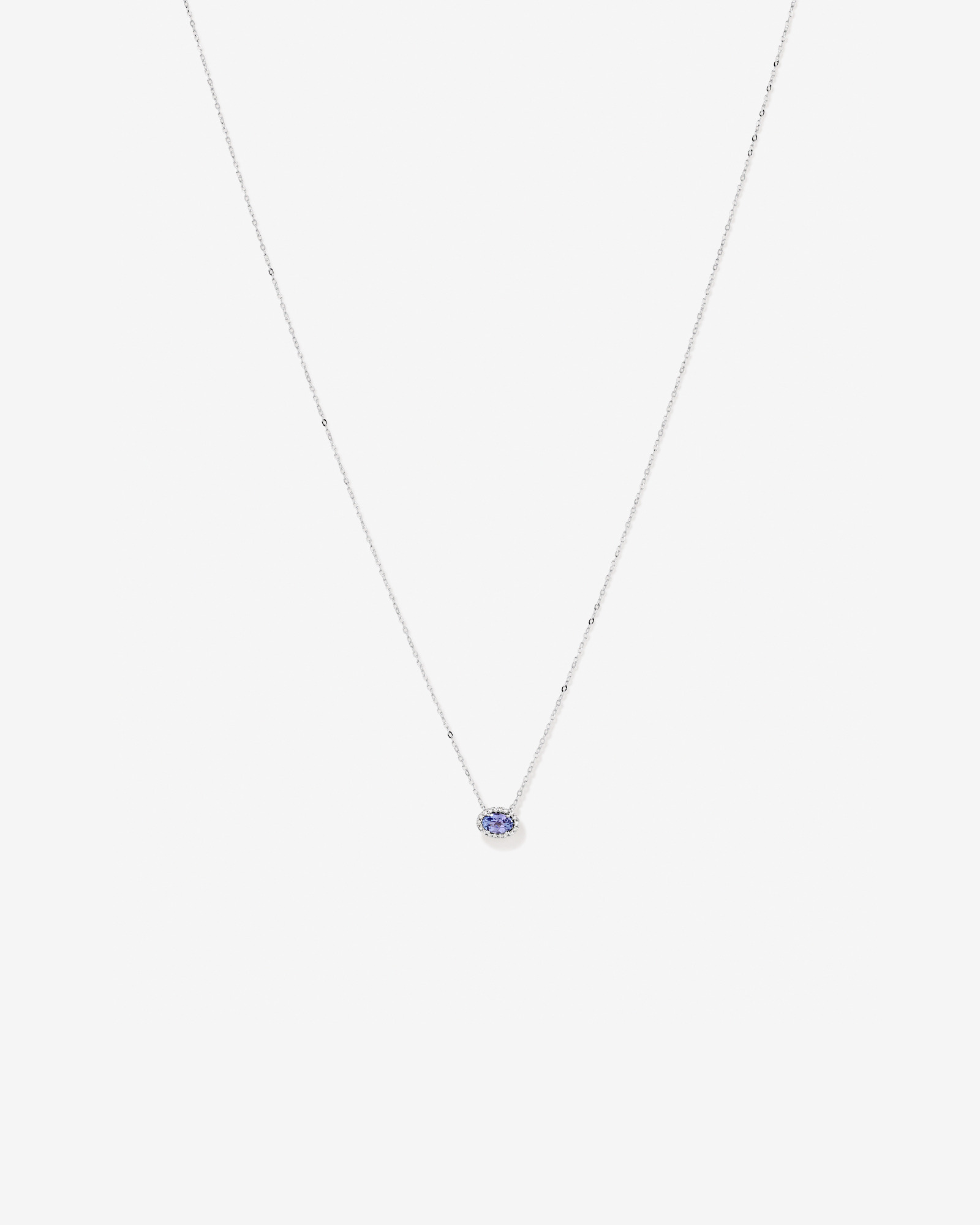 Oval Cut Blue Tanzanite Gemstone and 0.08 Carat TW Diamond Halo Pendant Necklace in 10kt White Gold