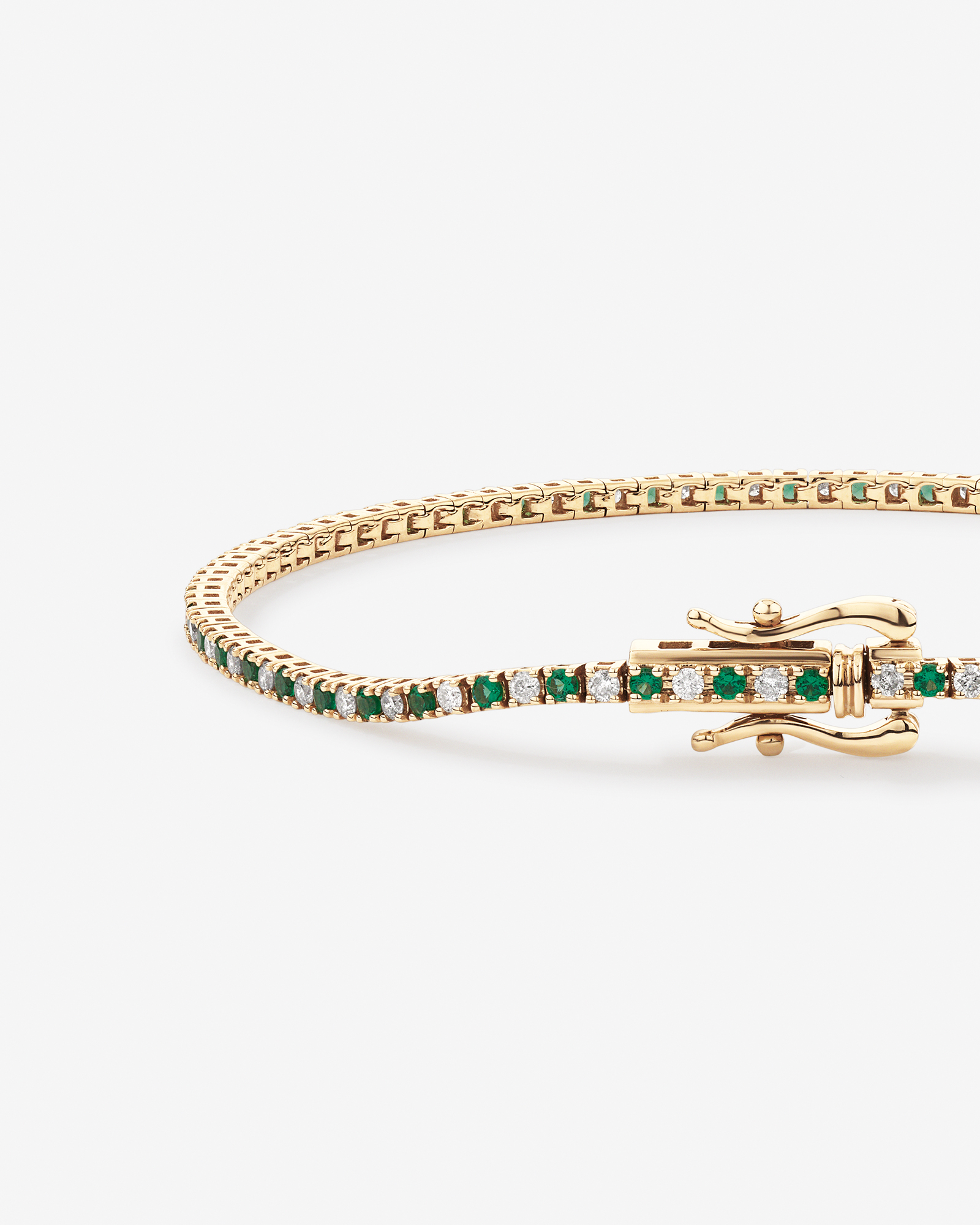 0.68 Carat TW Diamond and Created Emerald Tennis Bracelet in 10kt Yellow Gold