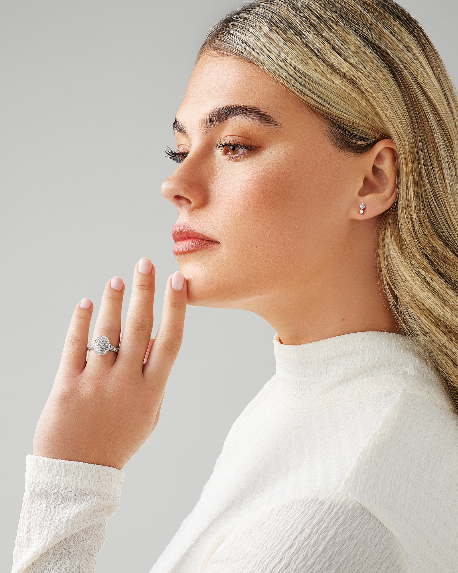 0.65 Carat TW Oval Shaped Cluster Halo Diamond Ring in 10kt White Gold