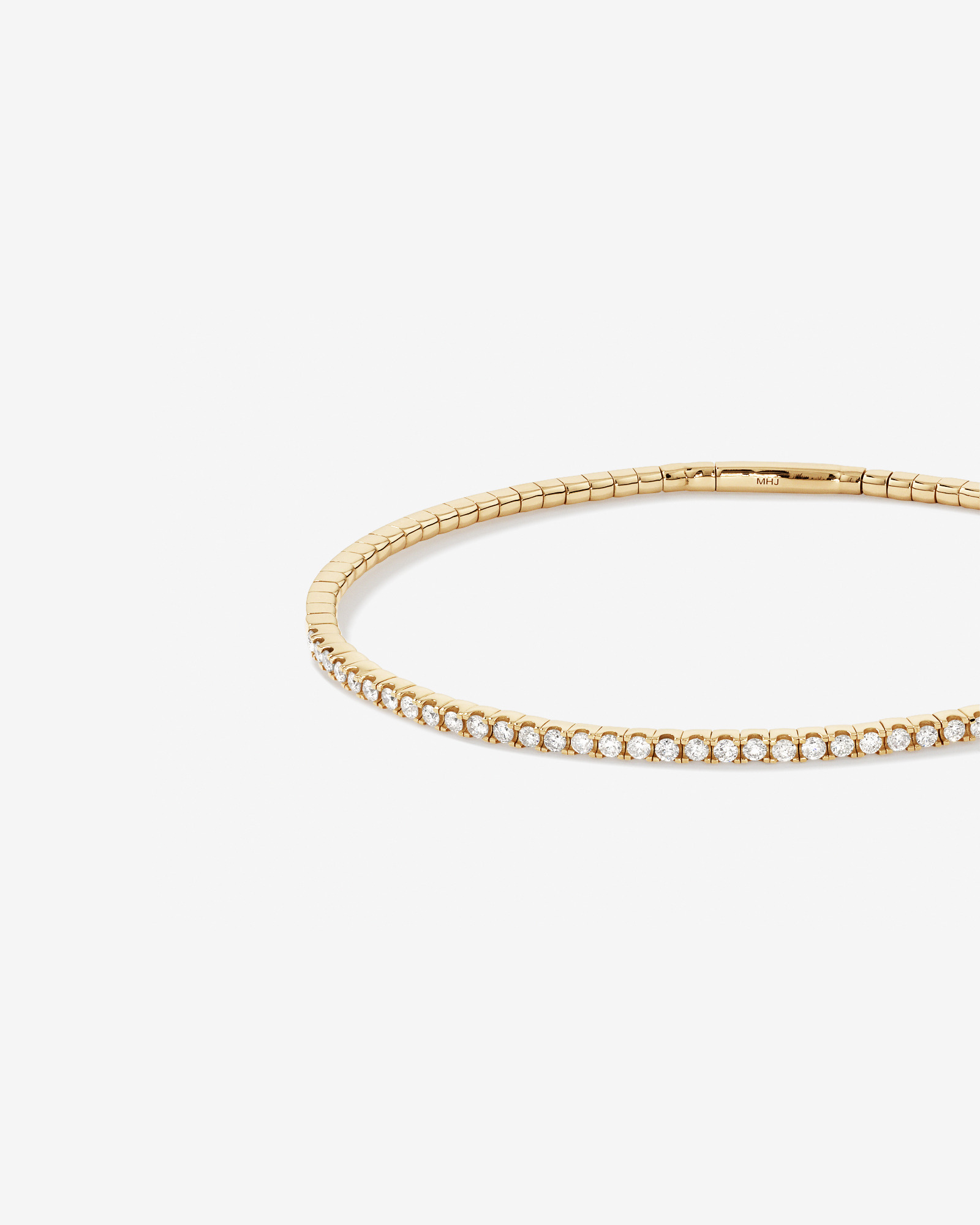 0.68 Carat TW Diamond Row Flex Bangle in 10kt Yellow Gold