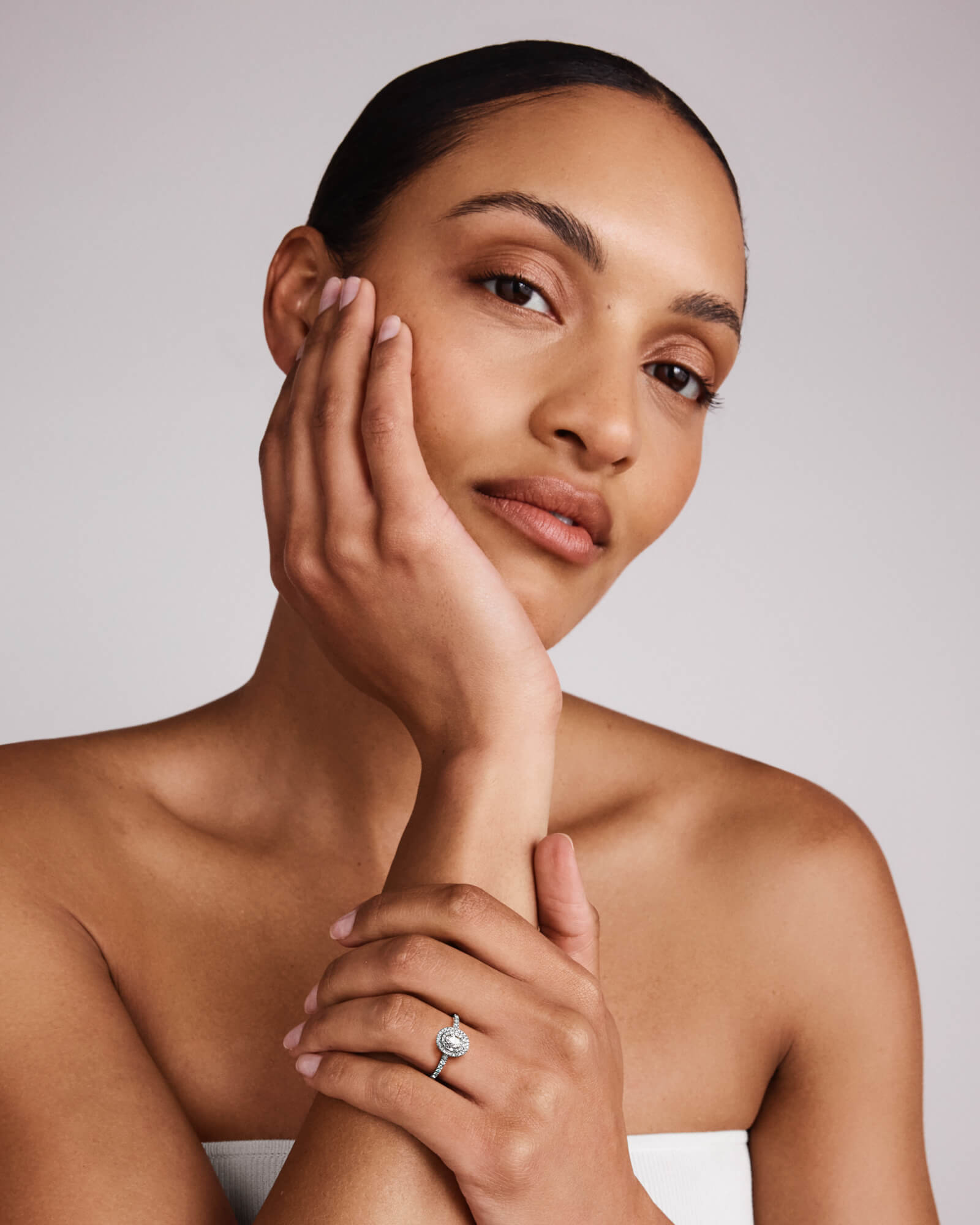 0.58 Carat TW Oval Diamond Halo Baguette Side Accent Engagement Ring in 14kt White Gold