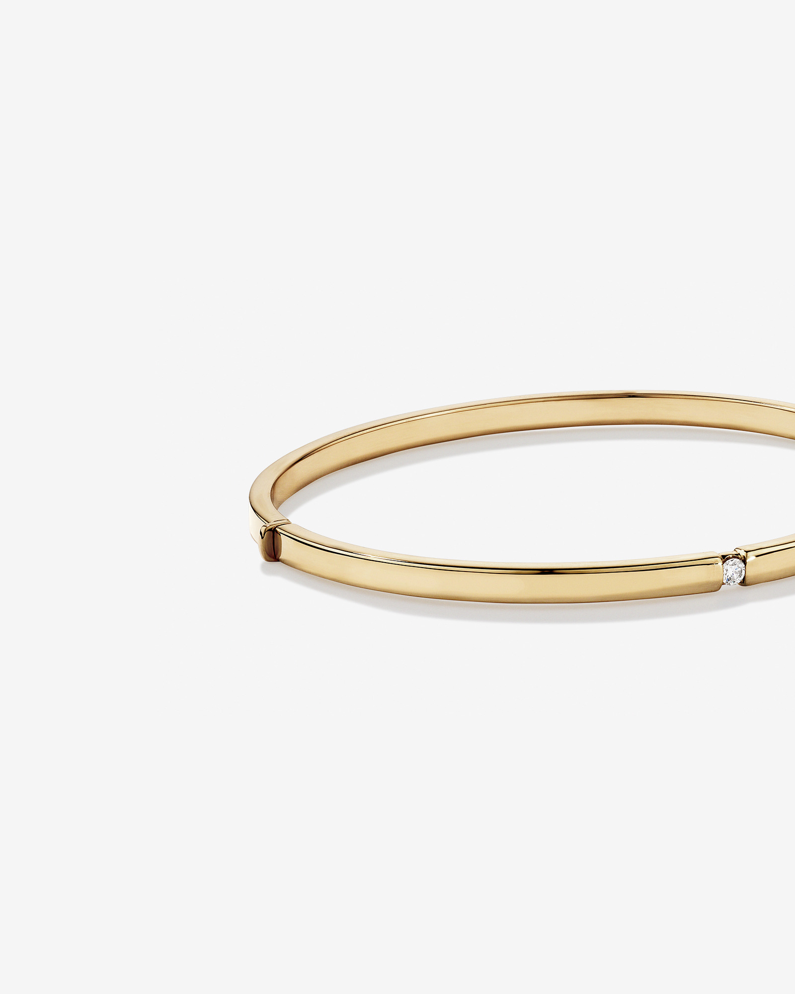 Diamond Accent Oval Bangle in 10kt Yellow Gold