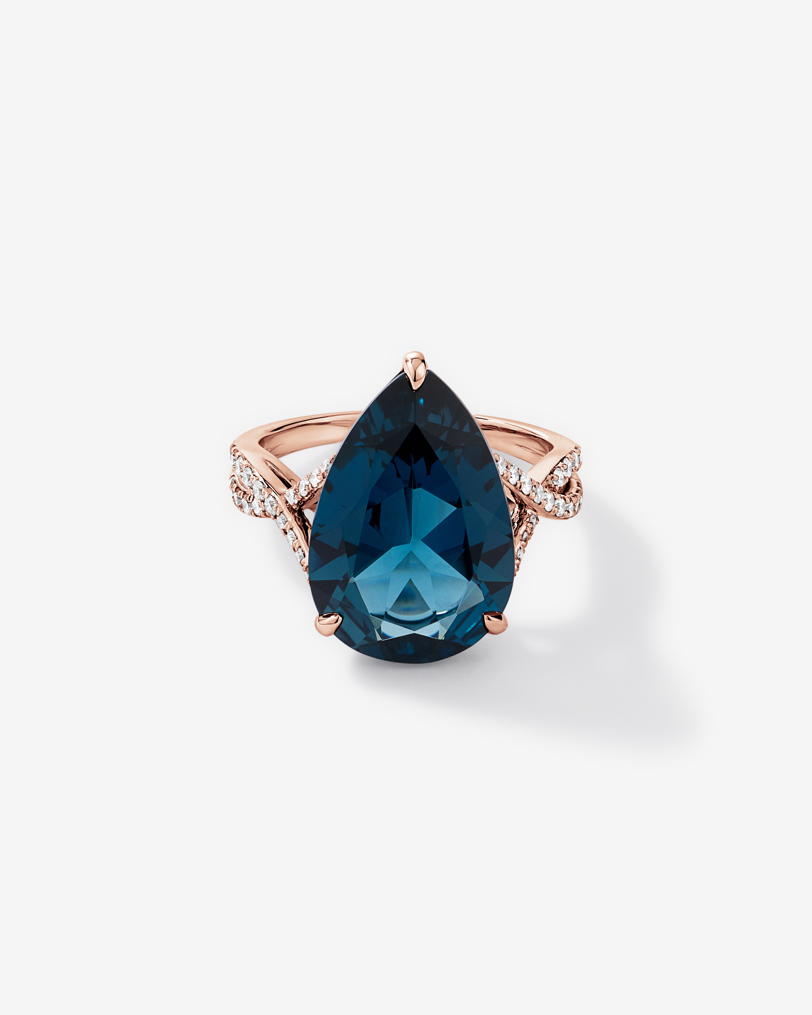 Pear Cut London Blue Topaz & 0.28 Carat TW Diamond Twist Ring 10kt Rose Gold