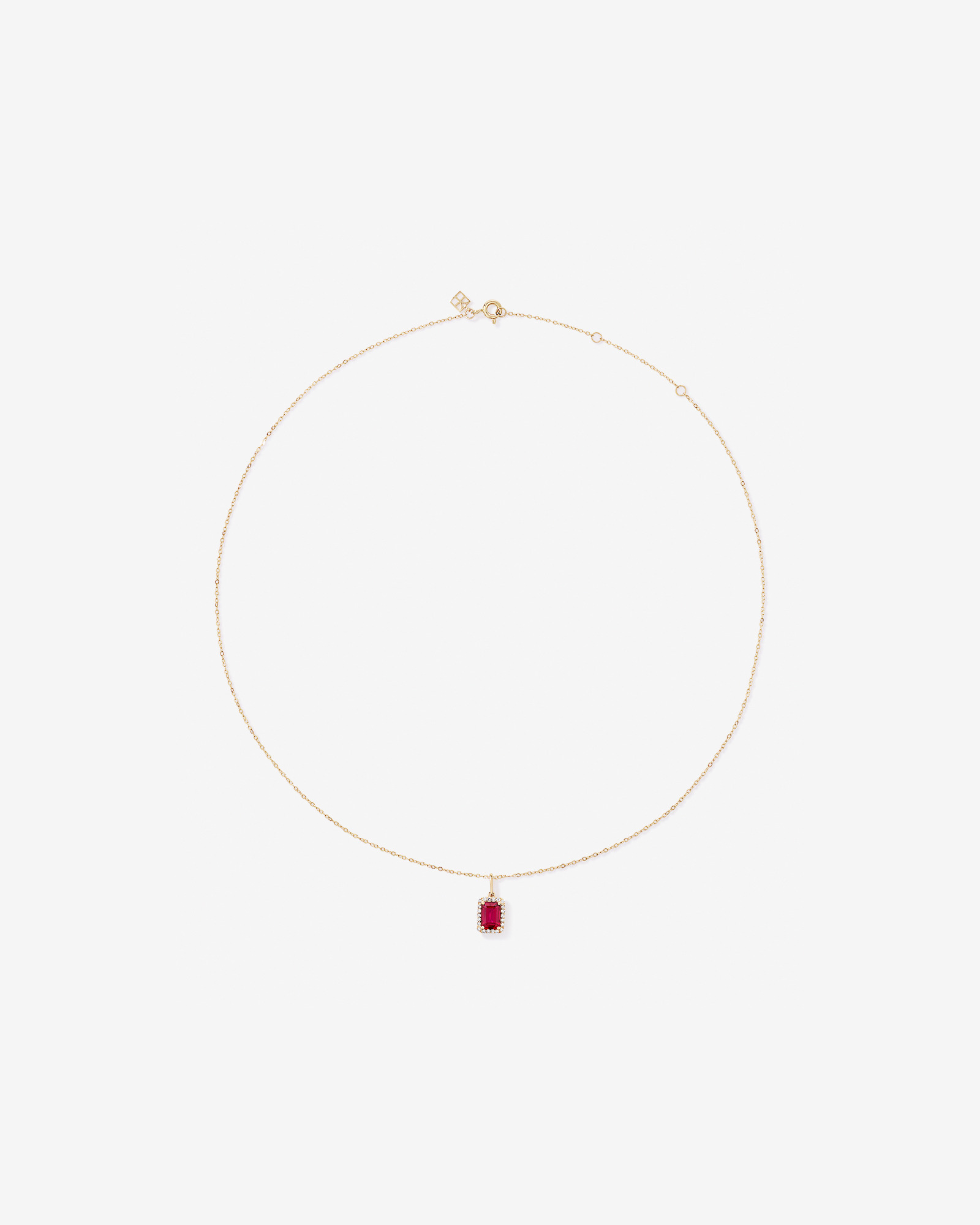 Emerald Cut Created Ruby and Diamond Halo Pendant with Chain in 10kt Yellow Gold