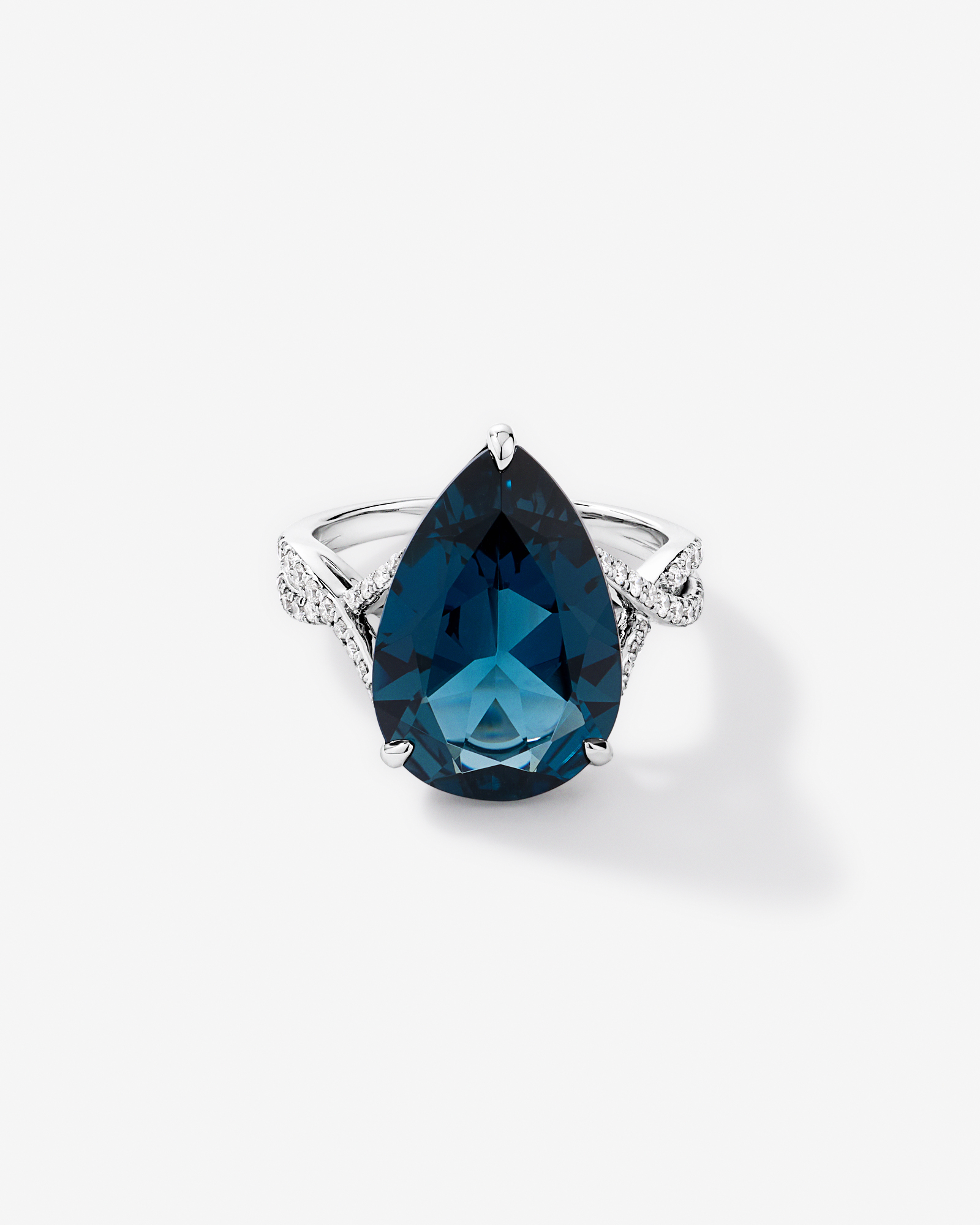 Pear Cut London Blue Topaz & 0.28 Carat TW Diamond Twist Ring 10kt Gold