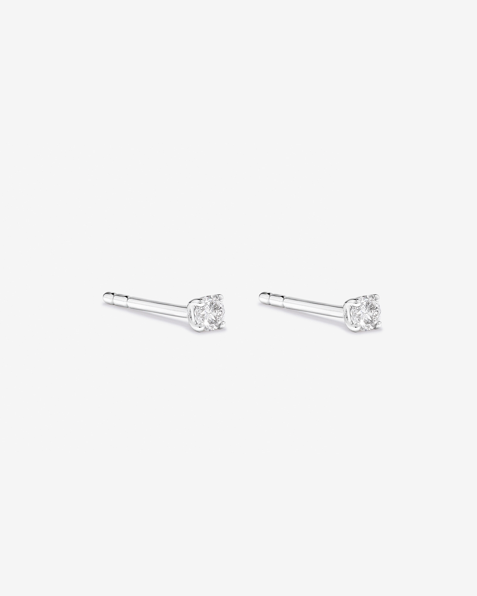 0,10 Carat TW Boucles d'oreilles puces solitaires en or jaune 10kt