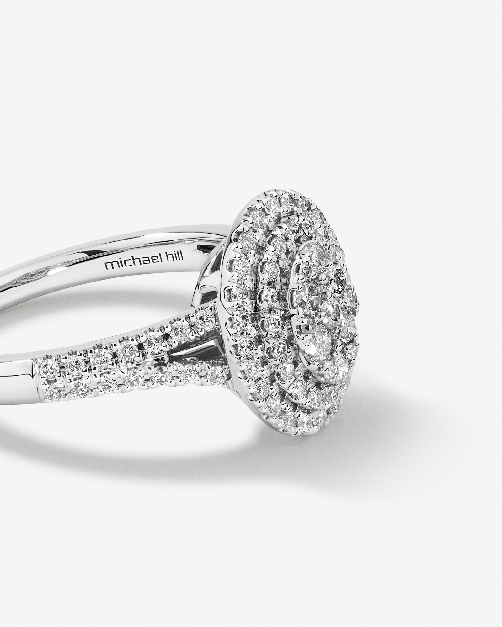 0.65 Carat TW Oval Shaped Cluster Halo Diamond Ring in 10kt White Gold