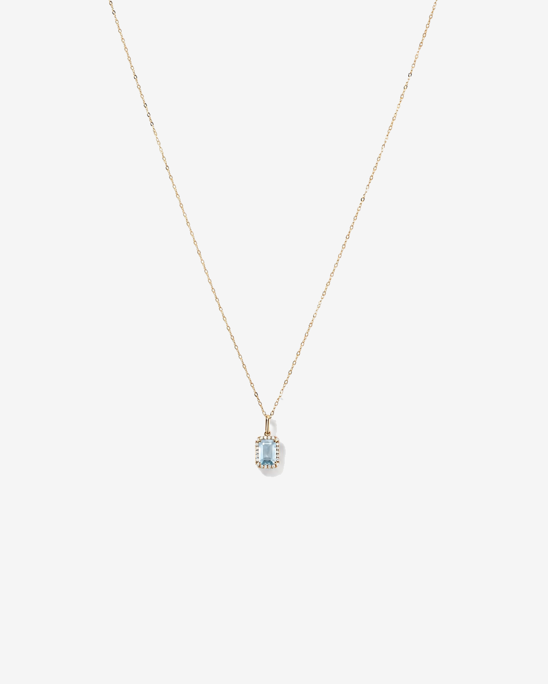 Emerald Cut Aquamarine and Diamond Halo Pendant with Chain in 10kt Yellow Gold