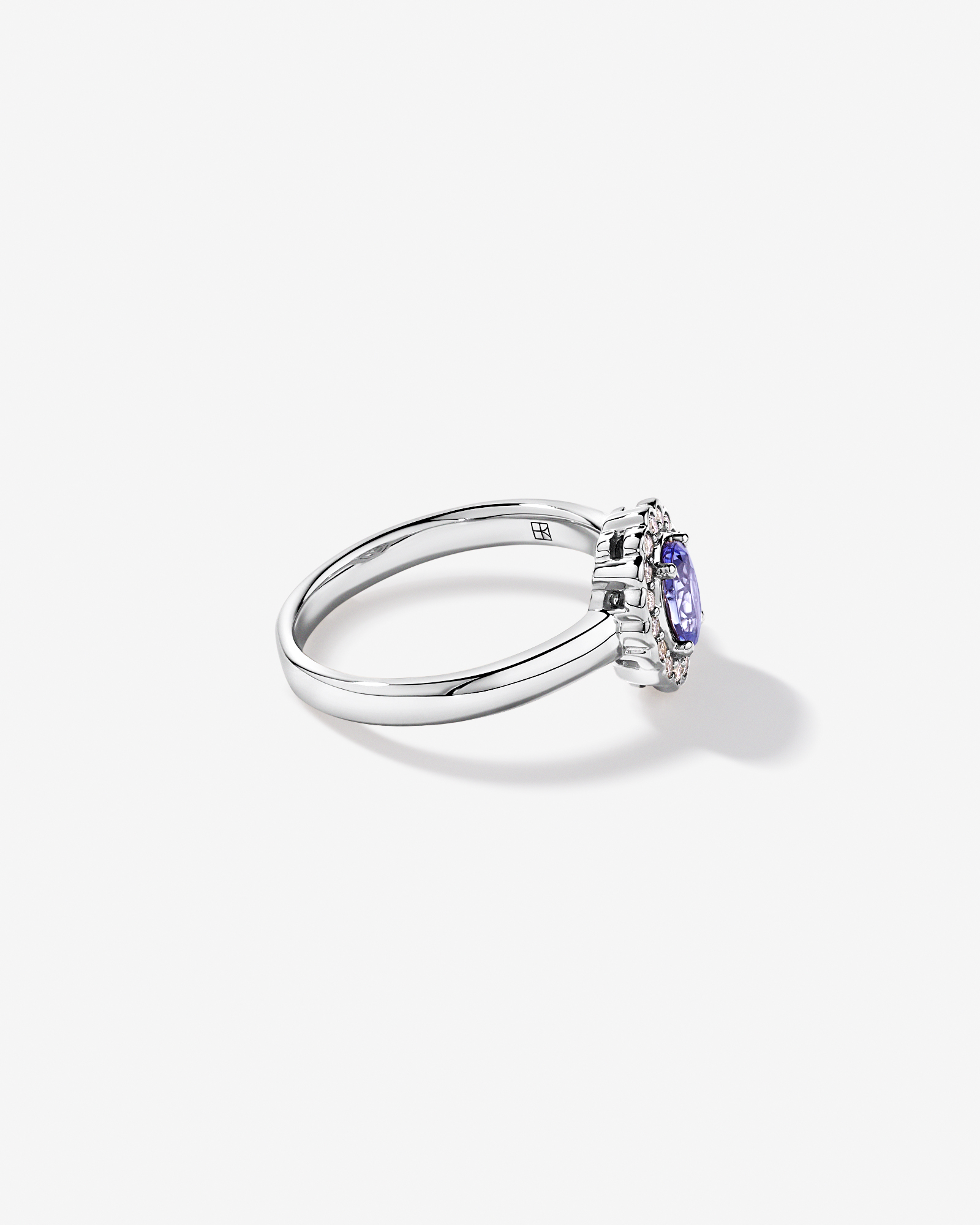 Tanzanite & 0.15TW of Diamond Halo Ring 10kt White Gold