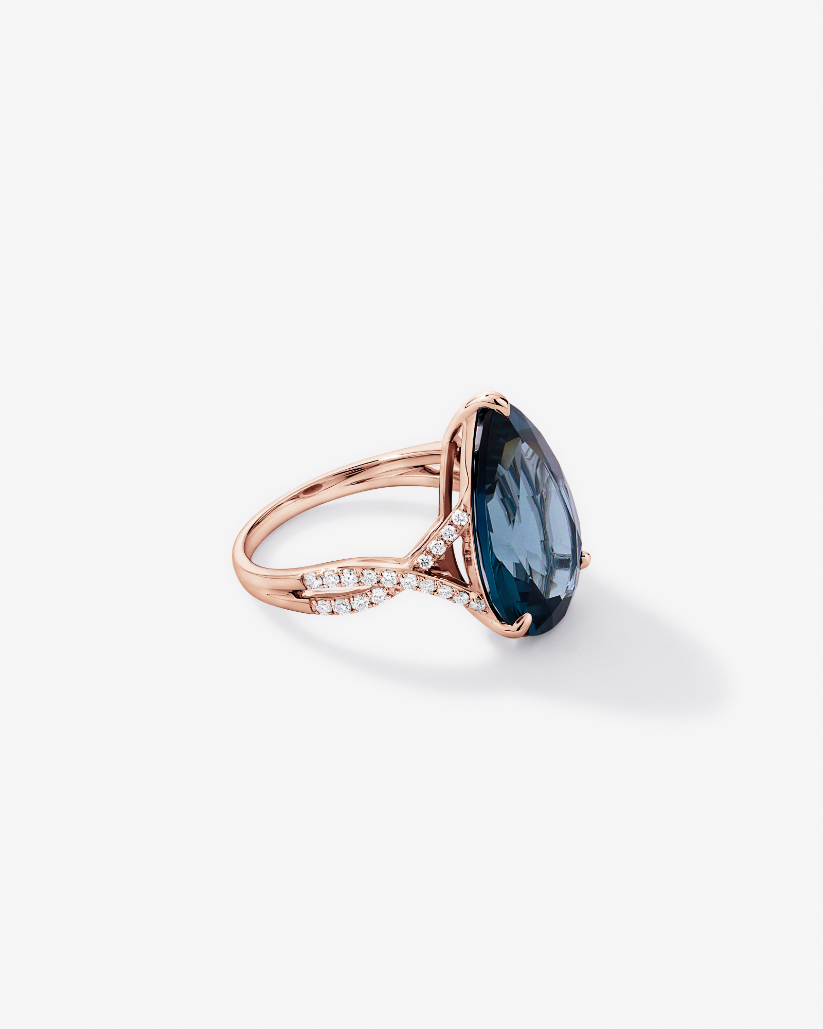 Pear Cut London Blue Topaz & 0.28 Carat TW Diamond Twist Ring 10kt Rose Gold