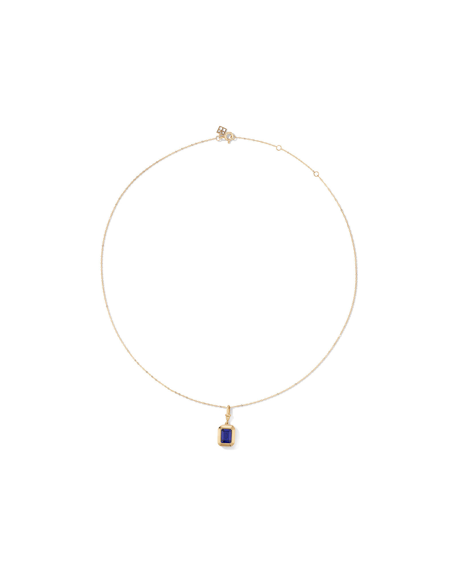 Emerald Cut Created Sapphire Bezel Pendant with Chain in 10kt Yellow Gold