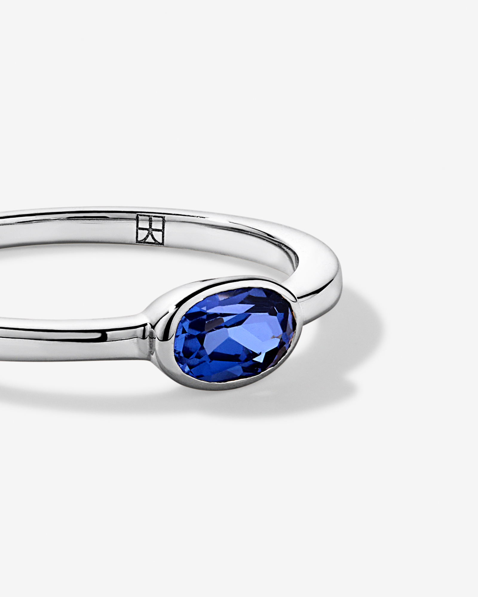 Oval Blue Created Sapphire East-to-West Set Bezel Ring 10kt Gold