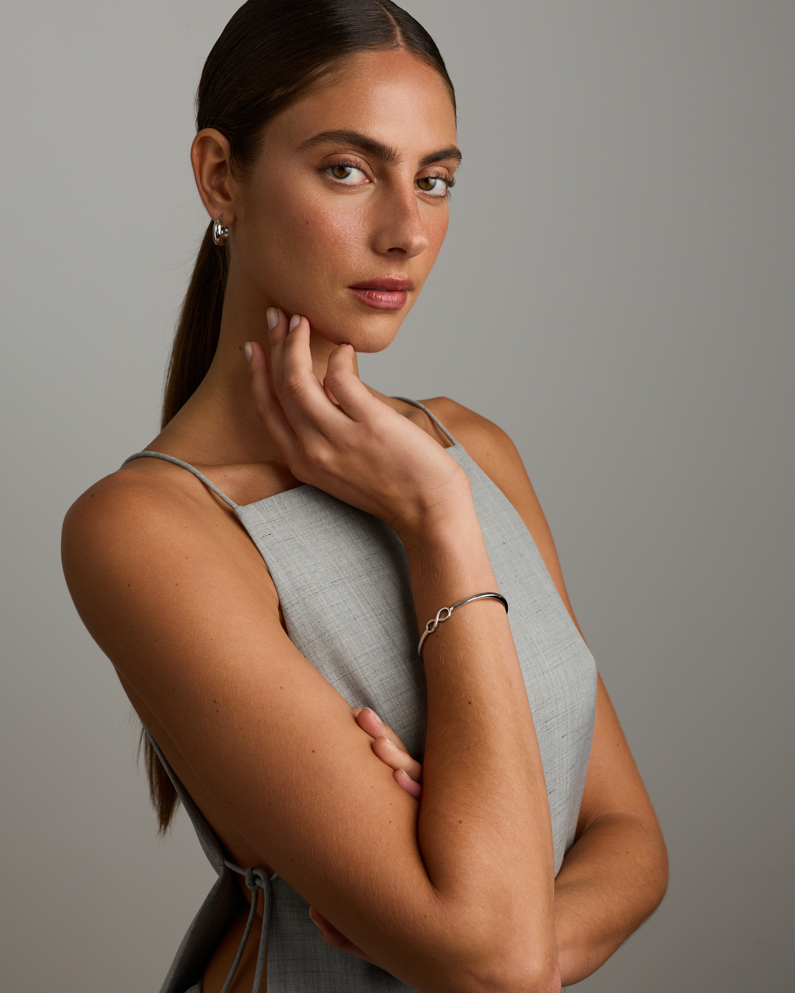 Diamond Accent Infinity Oval Hinge Bangle in Sterling Silver