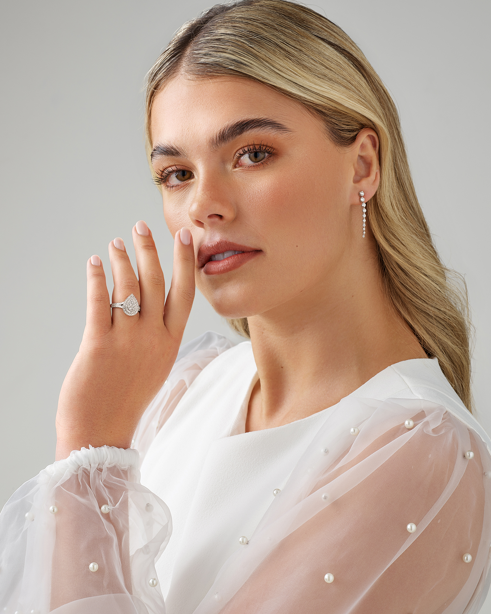 0.65 Carat TW Pear Shaped Cluster Halo Diamond Ring in 10kt White Gold