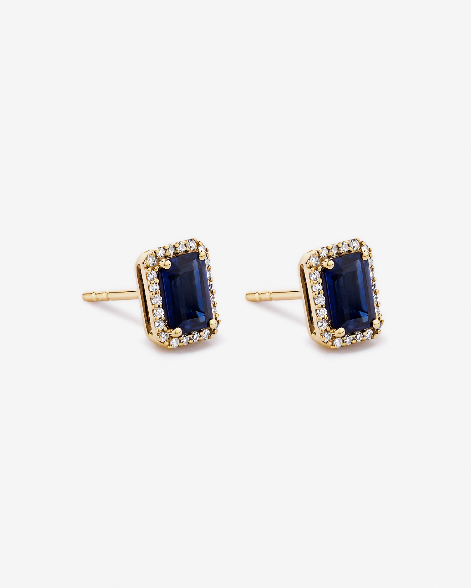 Emerald Cut Created Sapphire and Diamond Halo Earrings in 10kt Yellow Gold