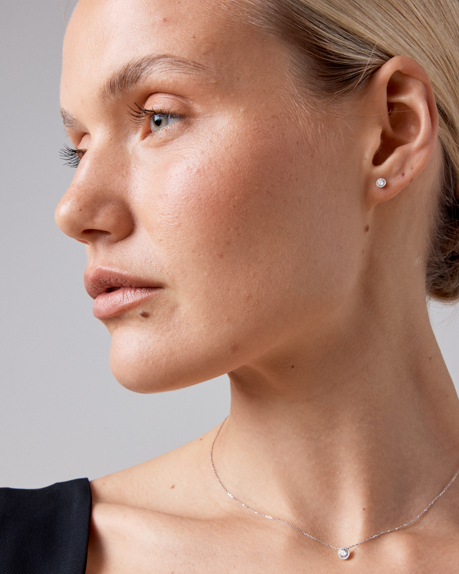 0.25 Carat TW Round Brilliant Diamond Solitaire Bezel Set Stud Earrings 18kt White Gold