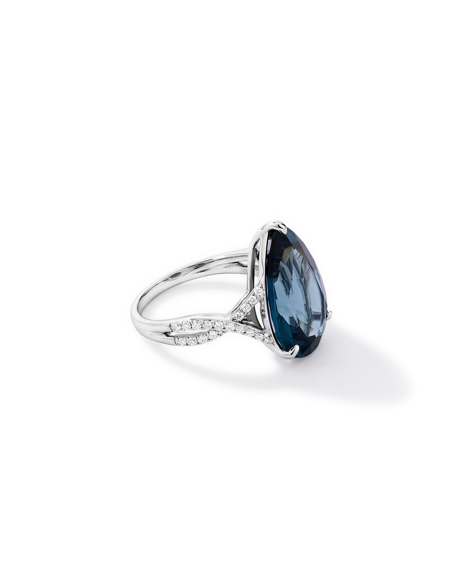 Pear Cut London Blue Topaz & 0.28 Carat TW Diamond Twist Ring 10kt Gold