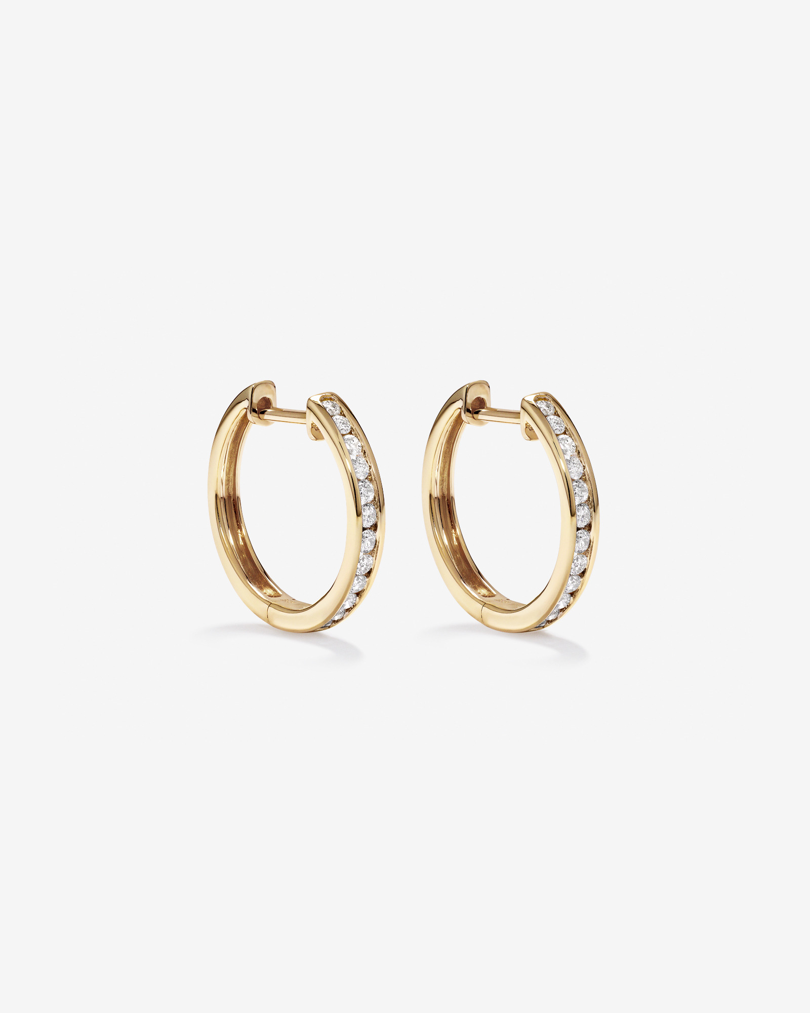 0.25 Carat TW Channel Set Round Brilliant Diamond Huggie Hoop Earrings in 10kt Yellow Gold