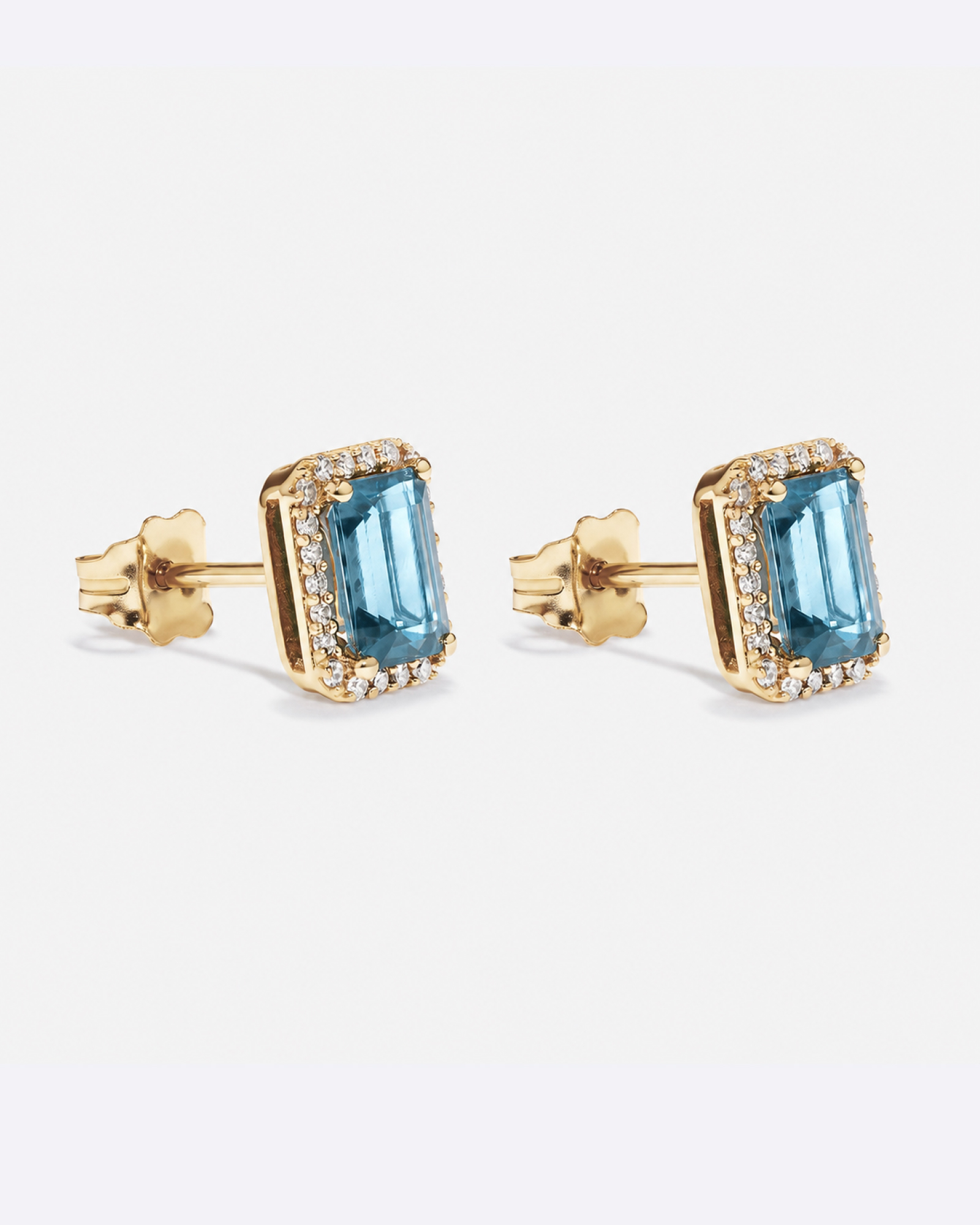 Emerald Cut Blue Topaz and Diamond Halo Earrings in 10kt Yellow Gold