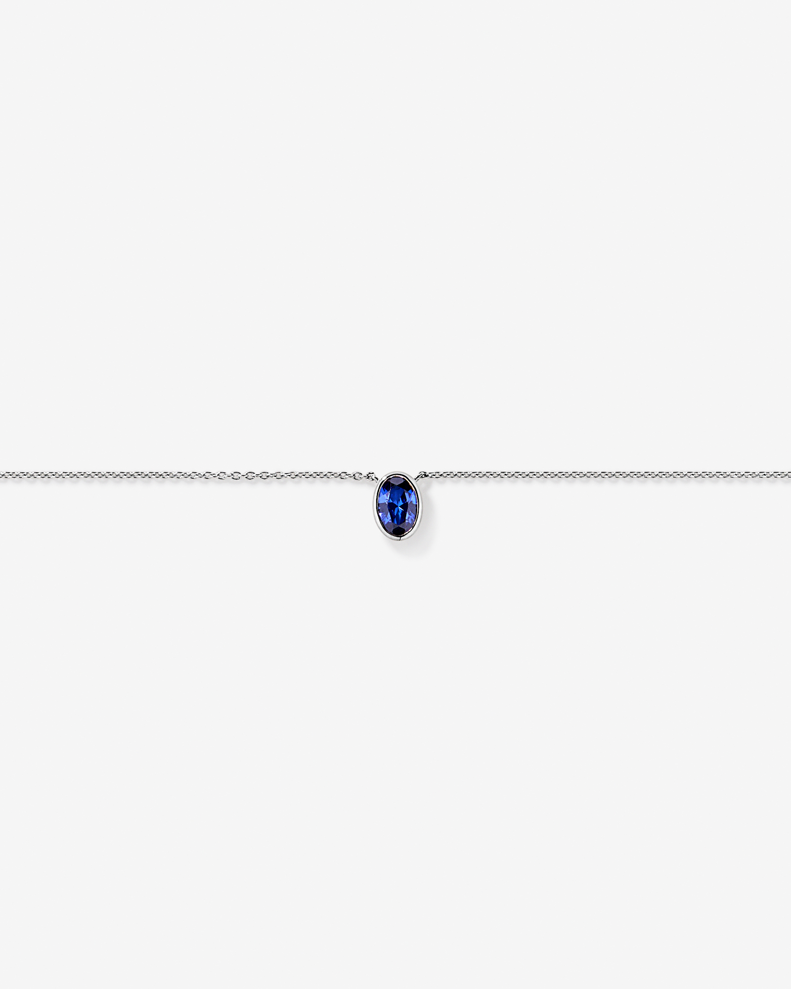 Oval Blue Created Sapphire Bezel Necklace in 10kt White Gold