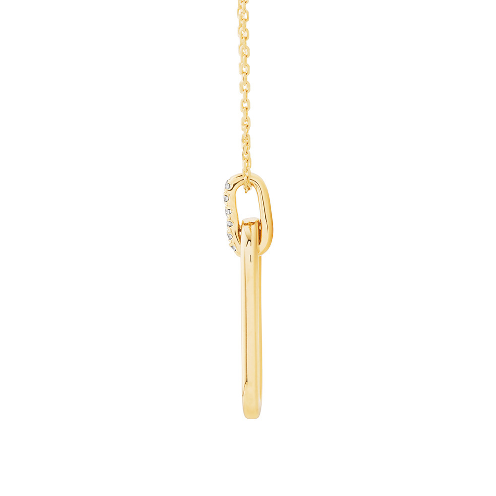 Pendentif trombone en or jaune 10 K avec diamants totalisant 0,02 ct