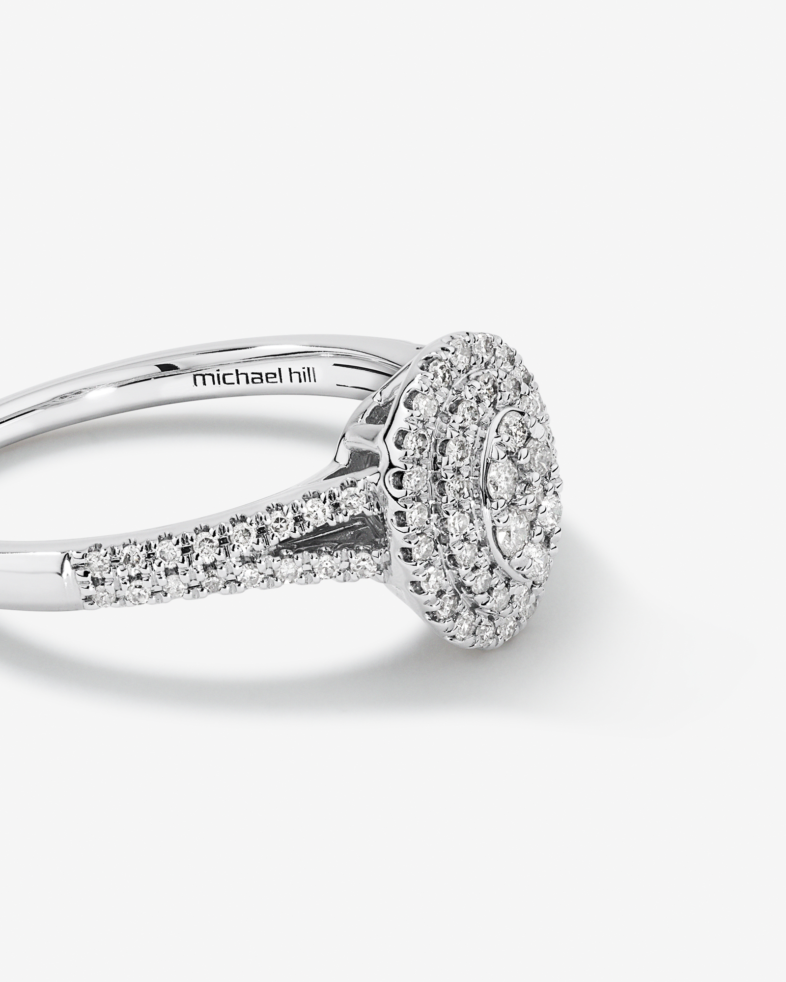 0.30 Carat TW Oval Shaped Cluster Halo Diamond Ring in 10kt White Gold