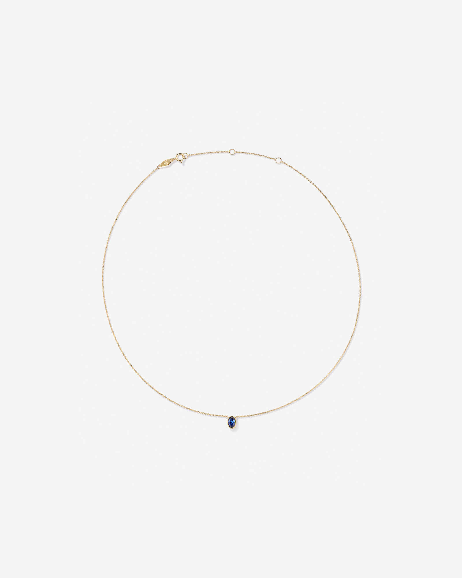 Oval Blue Created Sapphire Bezel Necklace in 10kt Yellow Gold