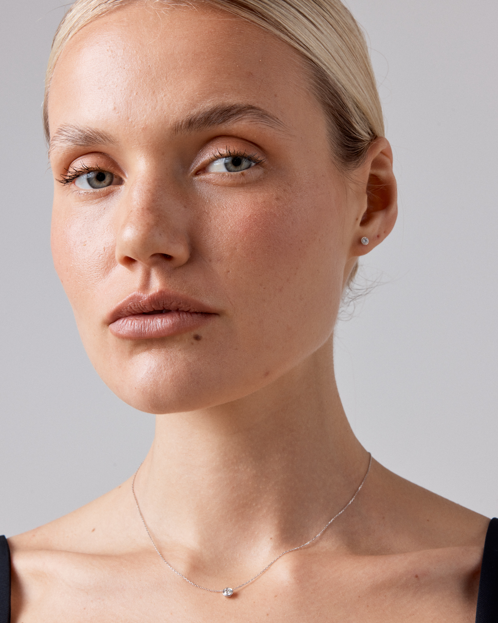 0.25 Carat TW Round Brilliant Diamond Bezel Set Pendant in 18kt White Gold