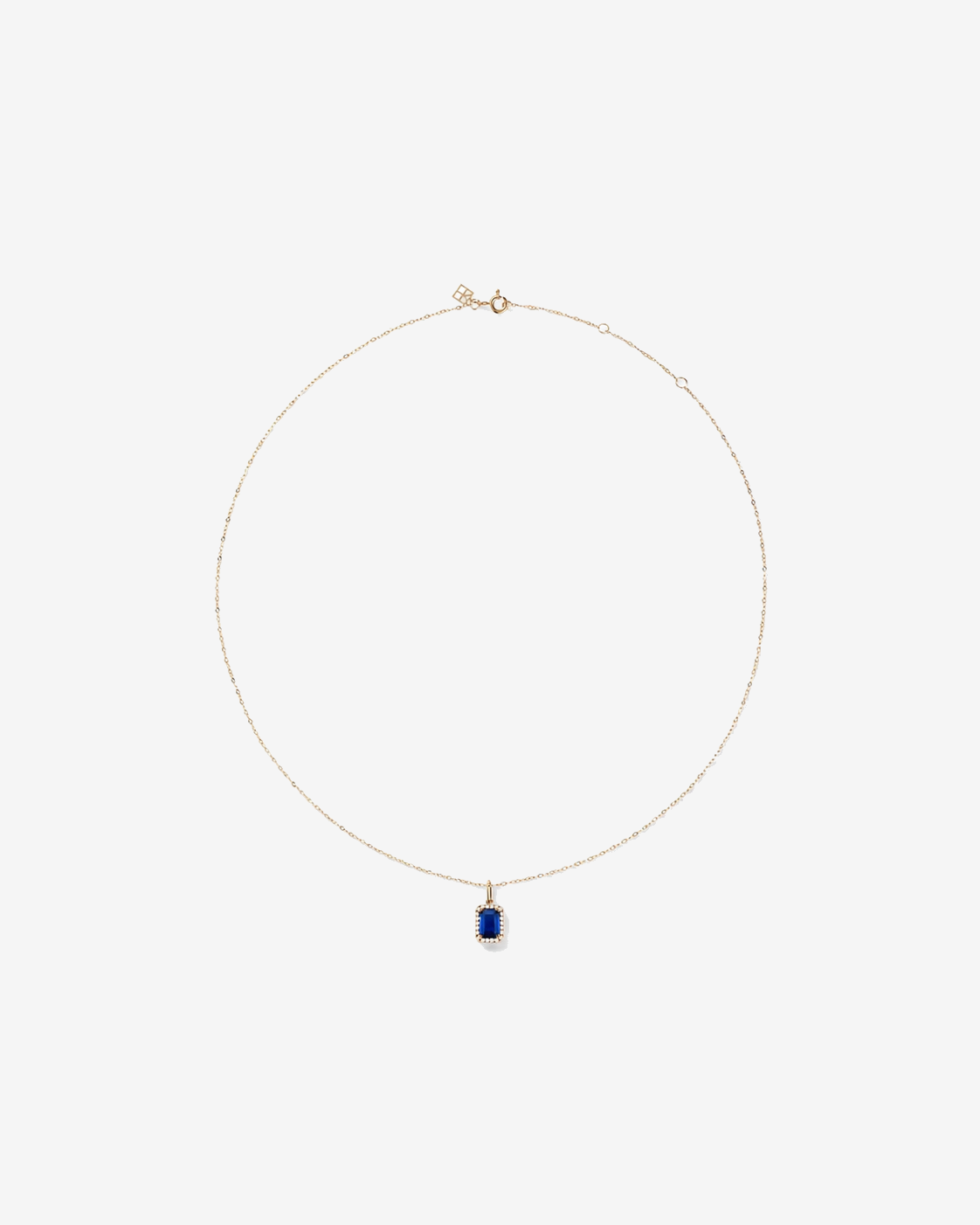 Emerald Cut Created Sapphire and Diamond Halo Pendant with Chain in 10kt Yellow Gold