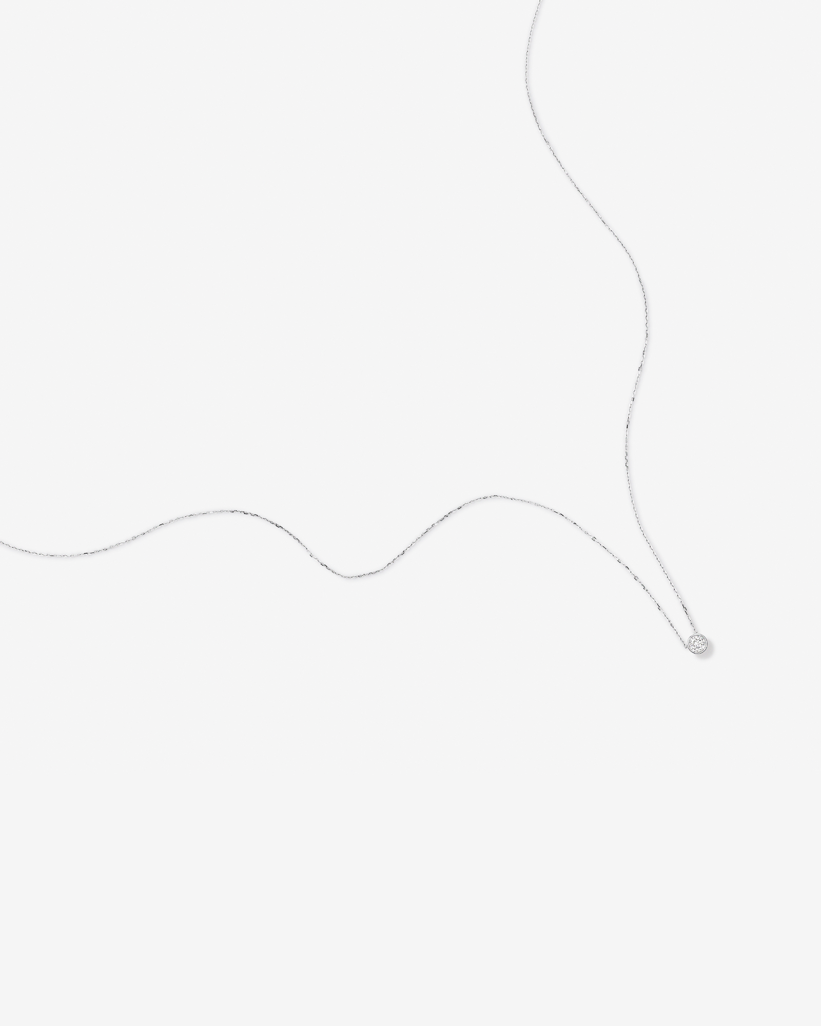 0.25 Carat TW Round Brilliant Diamond Bezel Set Pendant in 18kt White Gold