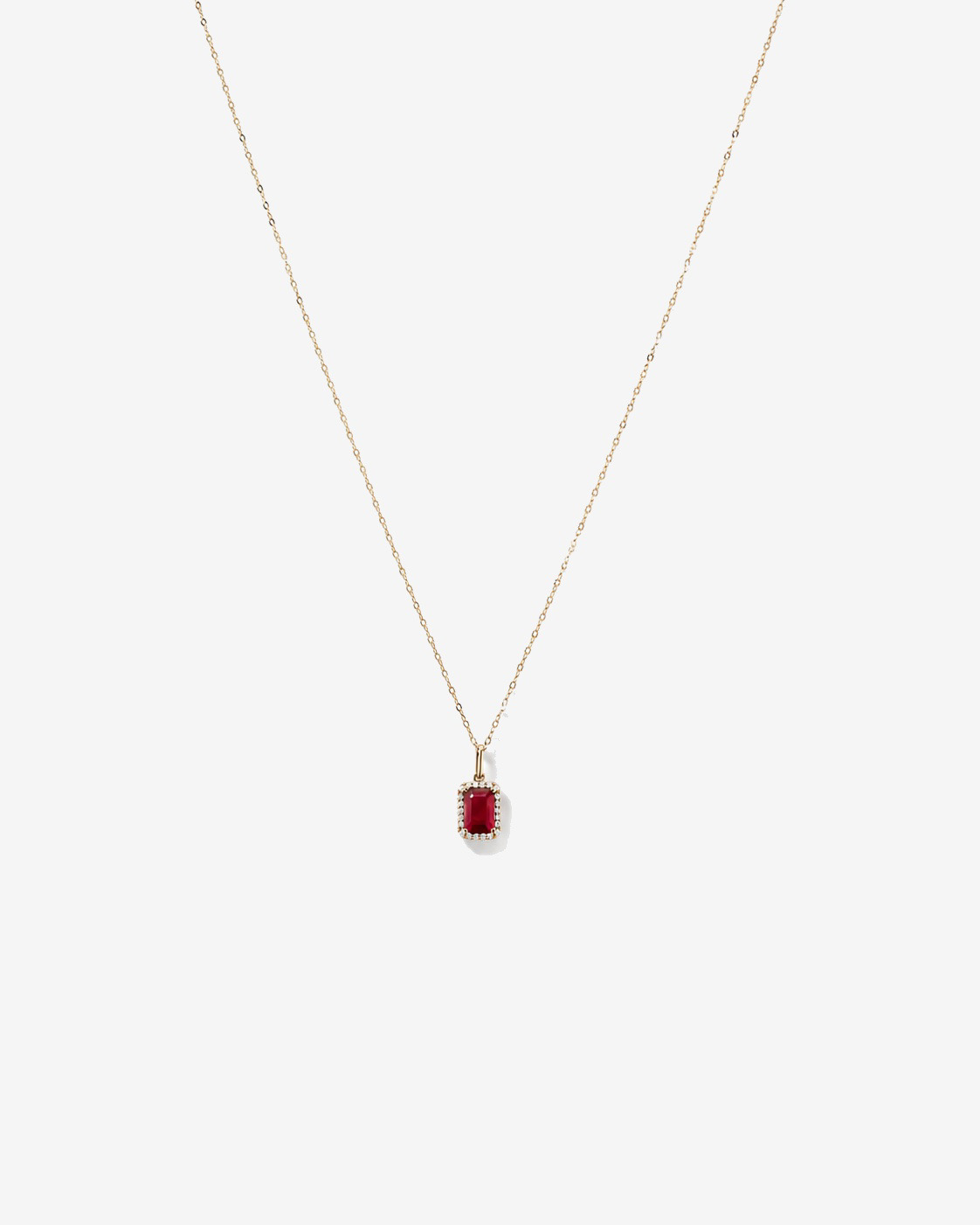 Emerald Cut Created Ruby and Diamond Halo Pendant with Chain in 10kt Yellow Gold
