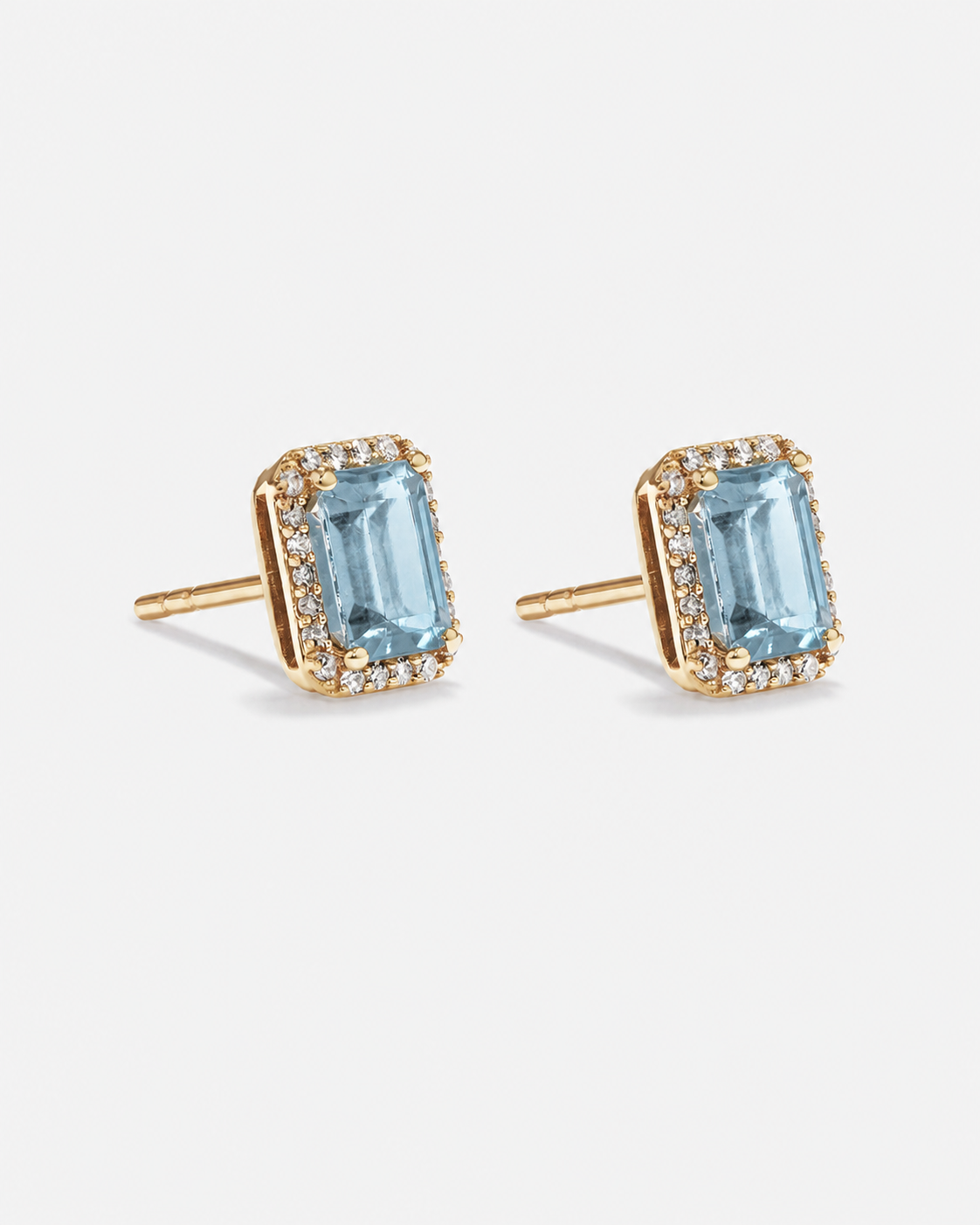 Emerald Cut Blue Topaz and Diamond Halo Earrings in 10kt Yellow Gold