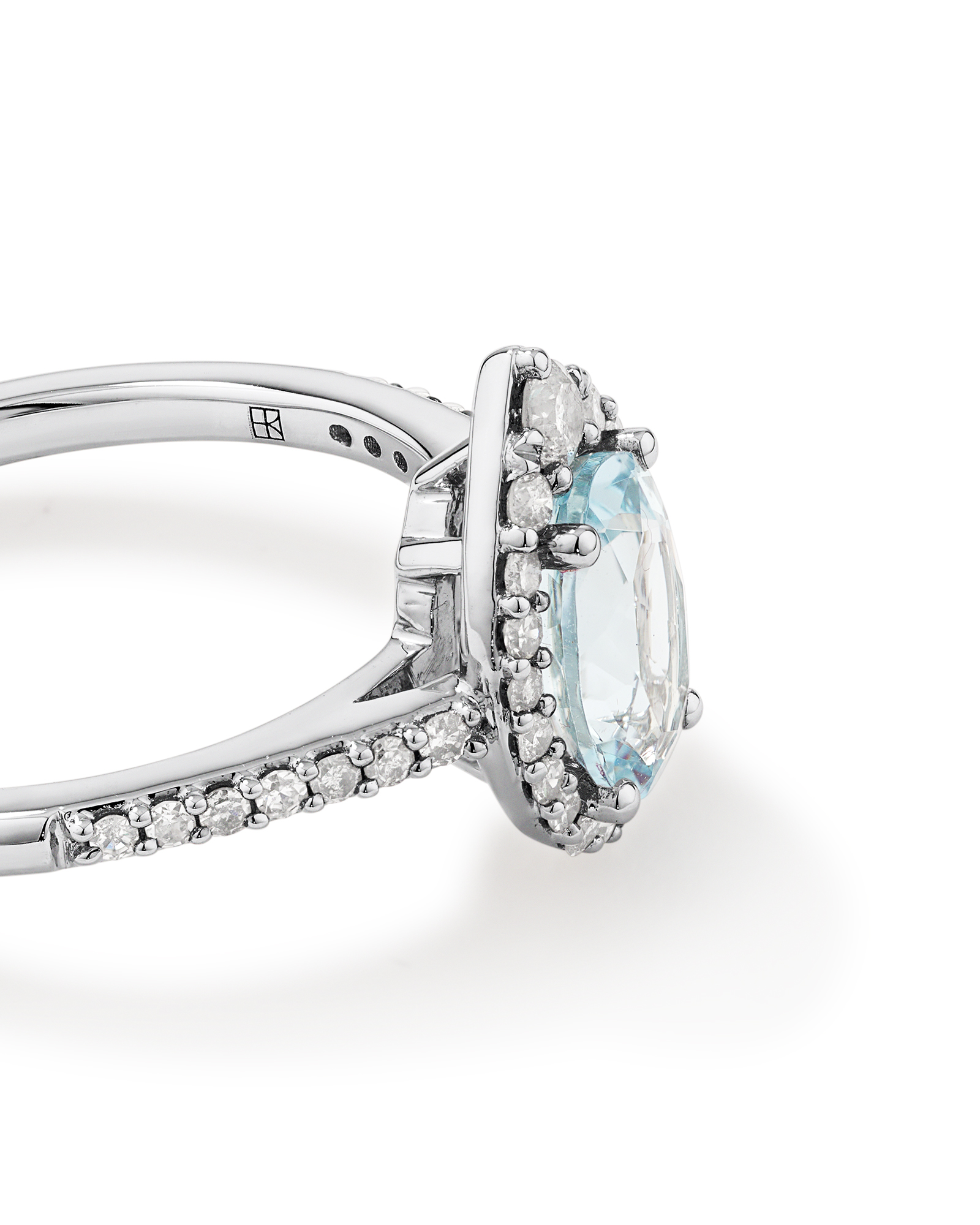 Oval Cut Blue Aquamarine Gemstone and 0.29 Carat TW Diamond Halo Ring in 10kt White Gold
