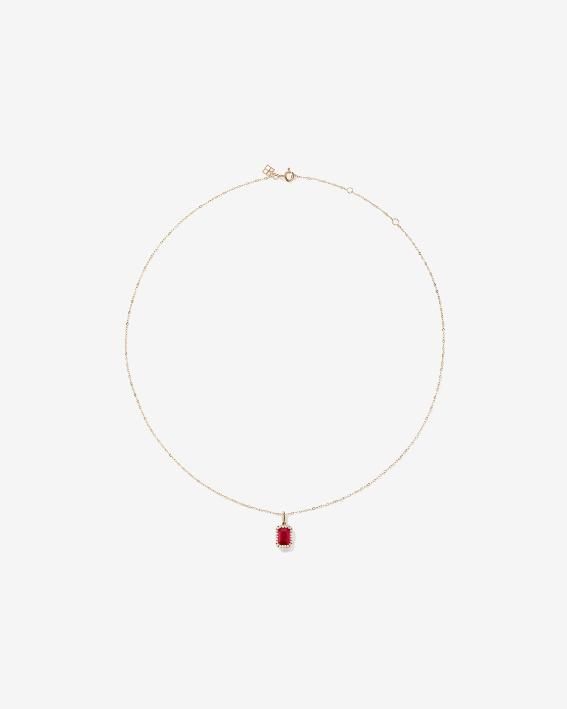 Emerald Cut Created Ruby and Diamond Halo Pendant with Chain in 10kt Yellow Gold
