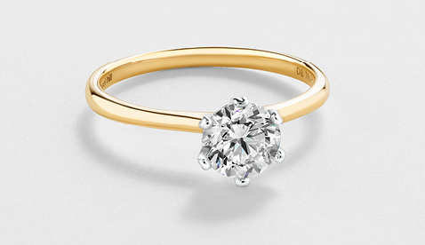 Michael Hill Solitaire Engagement Ring with a 1 Carat TW Diamond with the De Beers Code of Origin in 18kt Yellow & White Gold Michael Hill Solitaire Engagement Ring with a 1 Carat TW Diamond with the De Beers Code of Origin in 18kt Yellow & White Gold